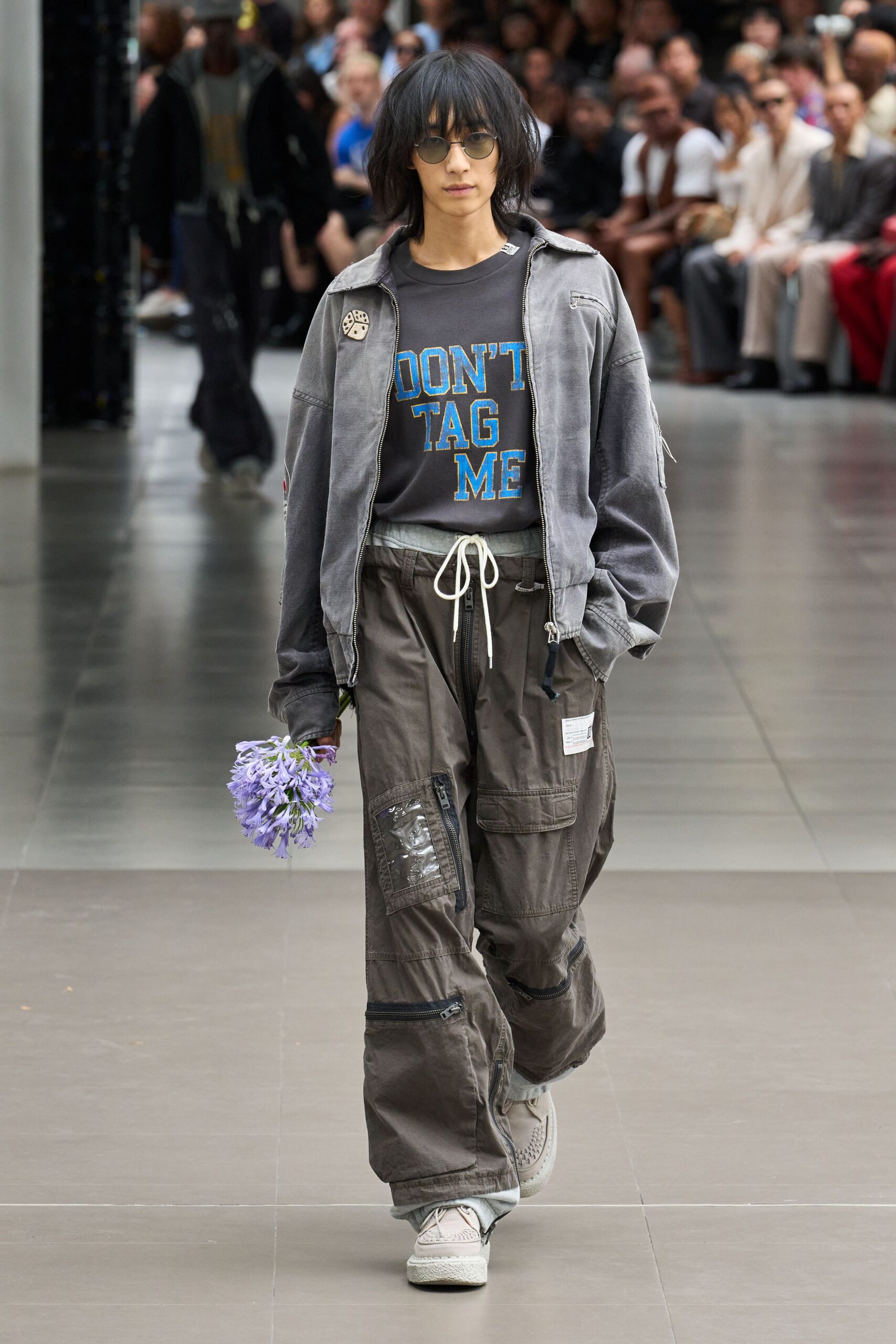 gray jacket black t-shirt green cargo pants