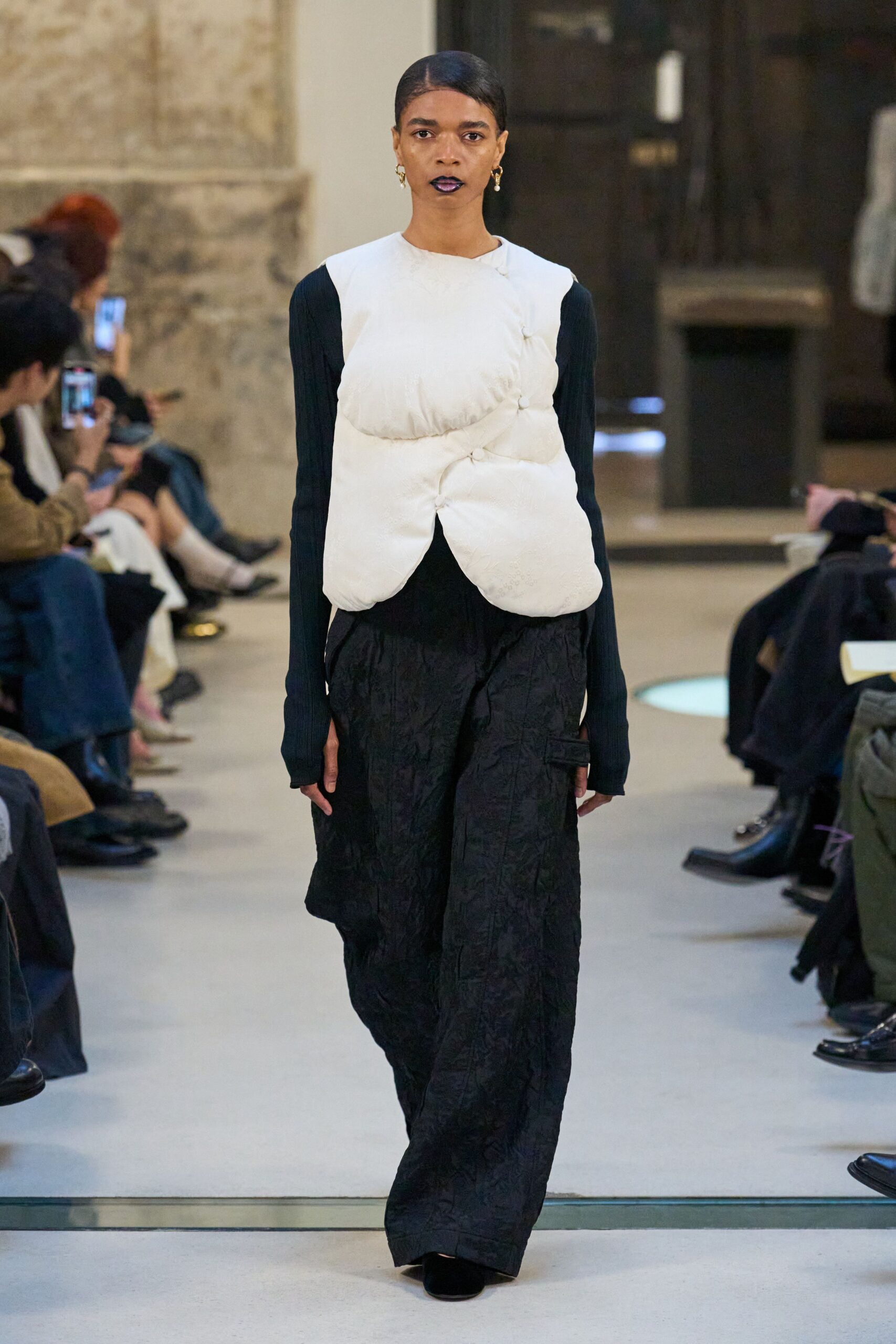 black fitted top with white vest
