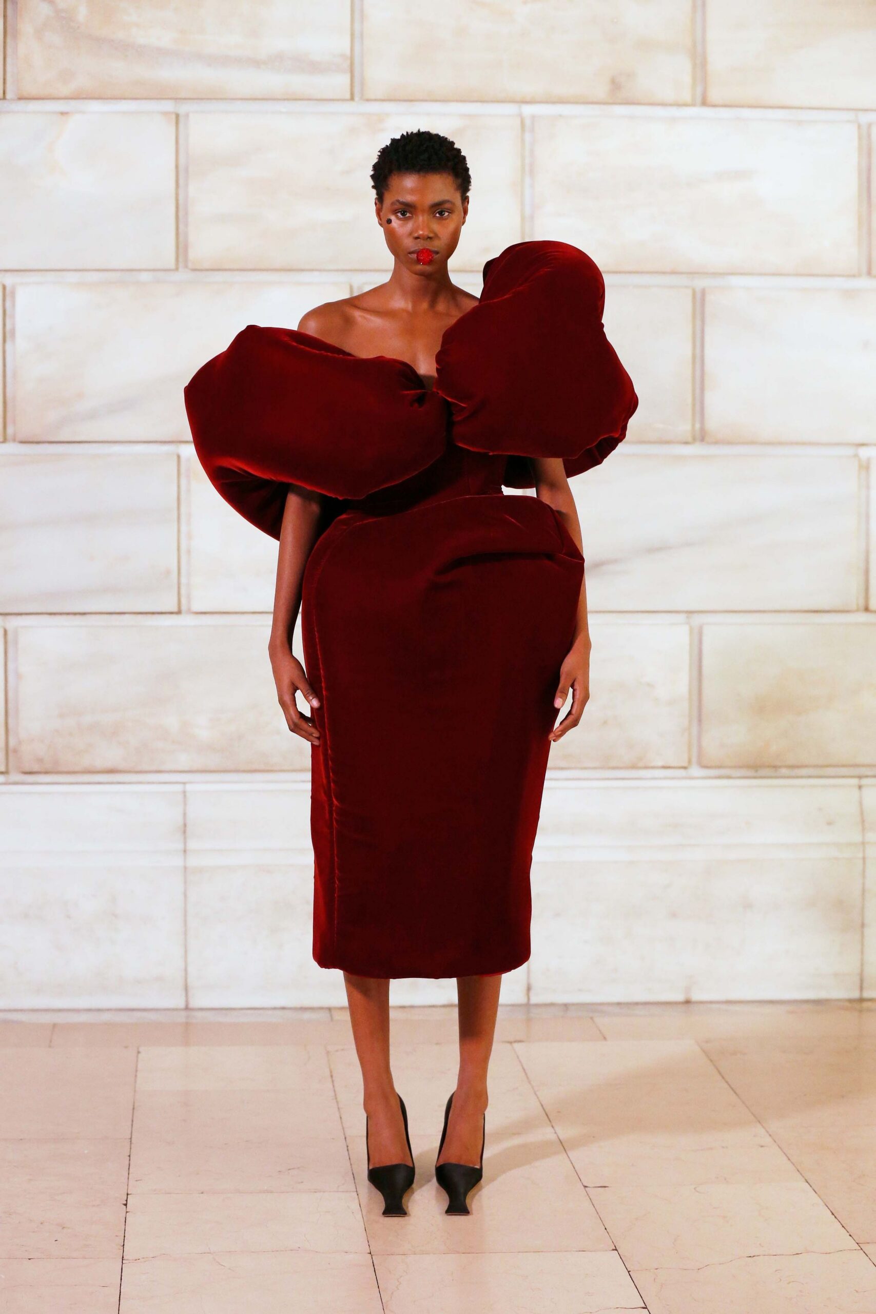 red velvet strapless fitted draped midi dress