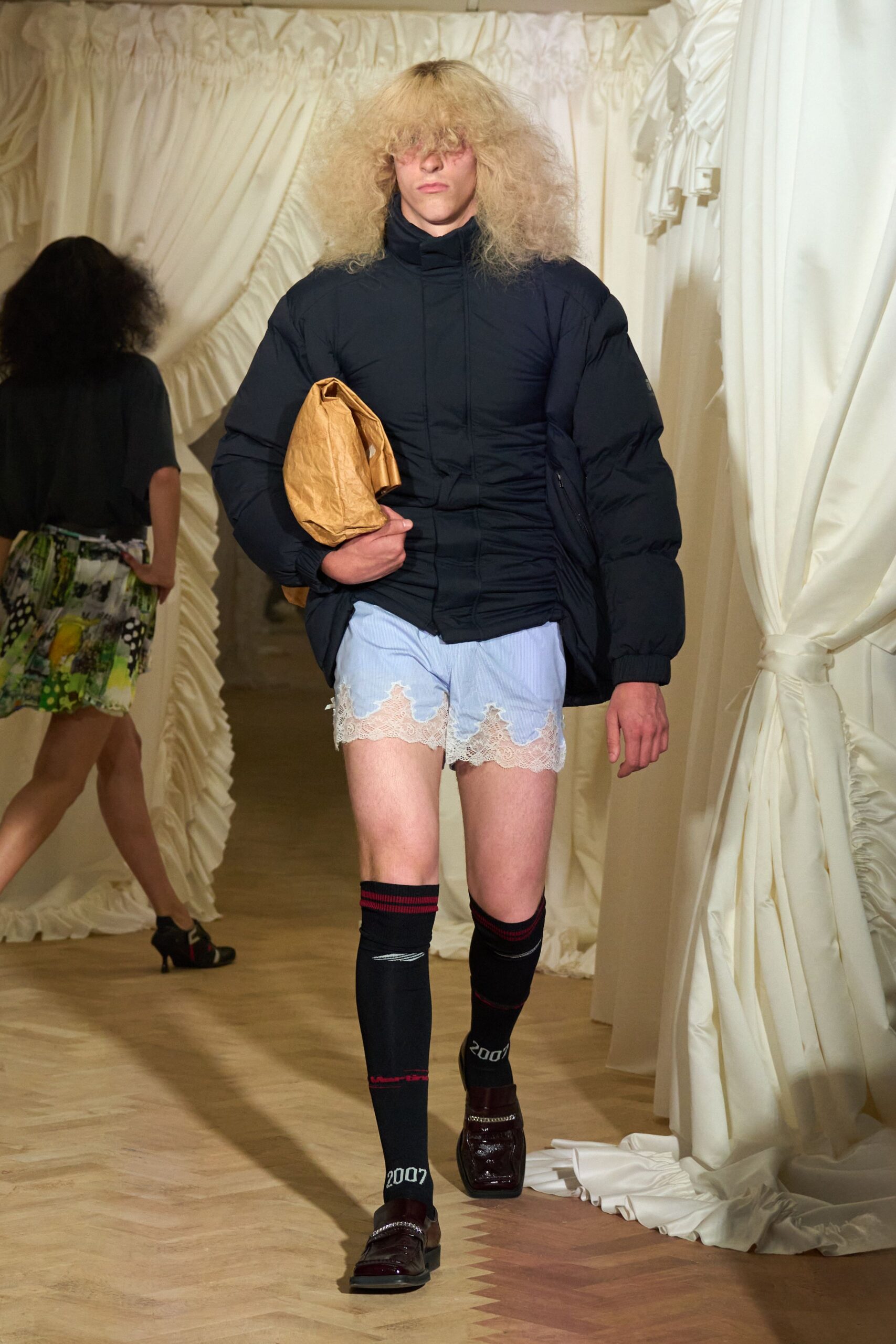 oversized black jacket with blue shorts