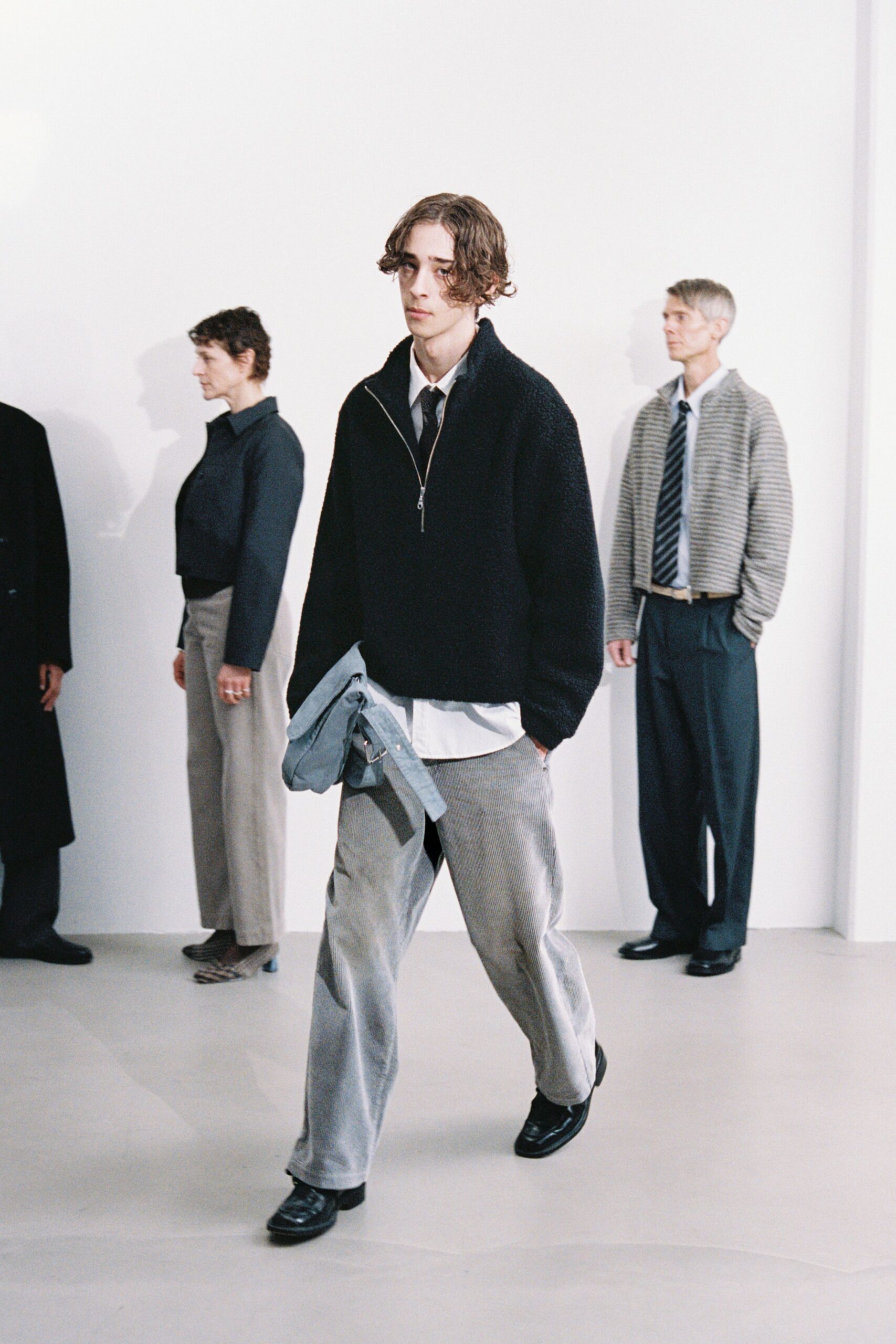 black wool sweater with gray pants