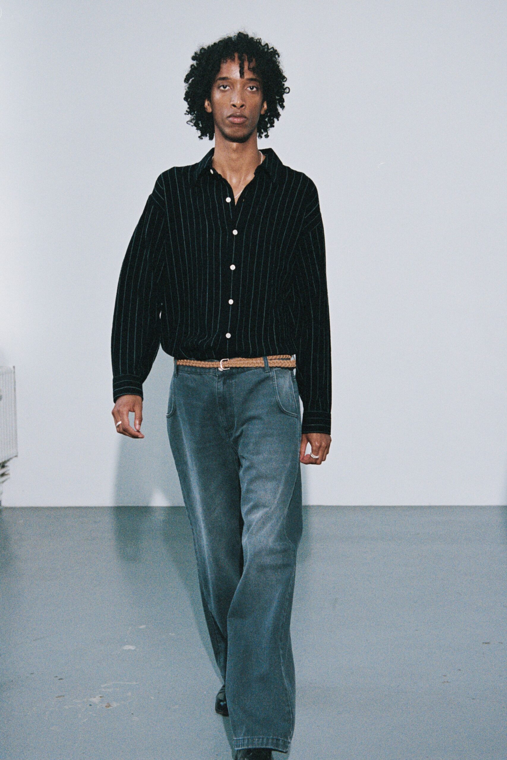 black striped shirt with gray pants