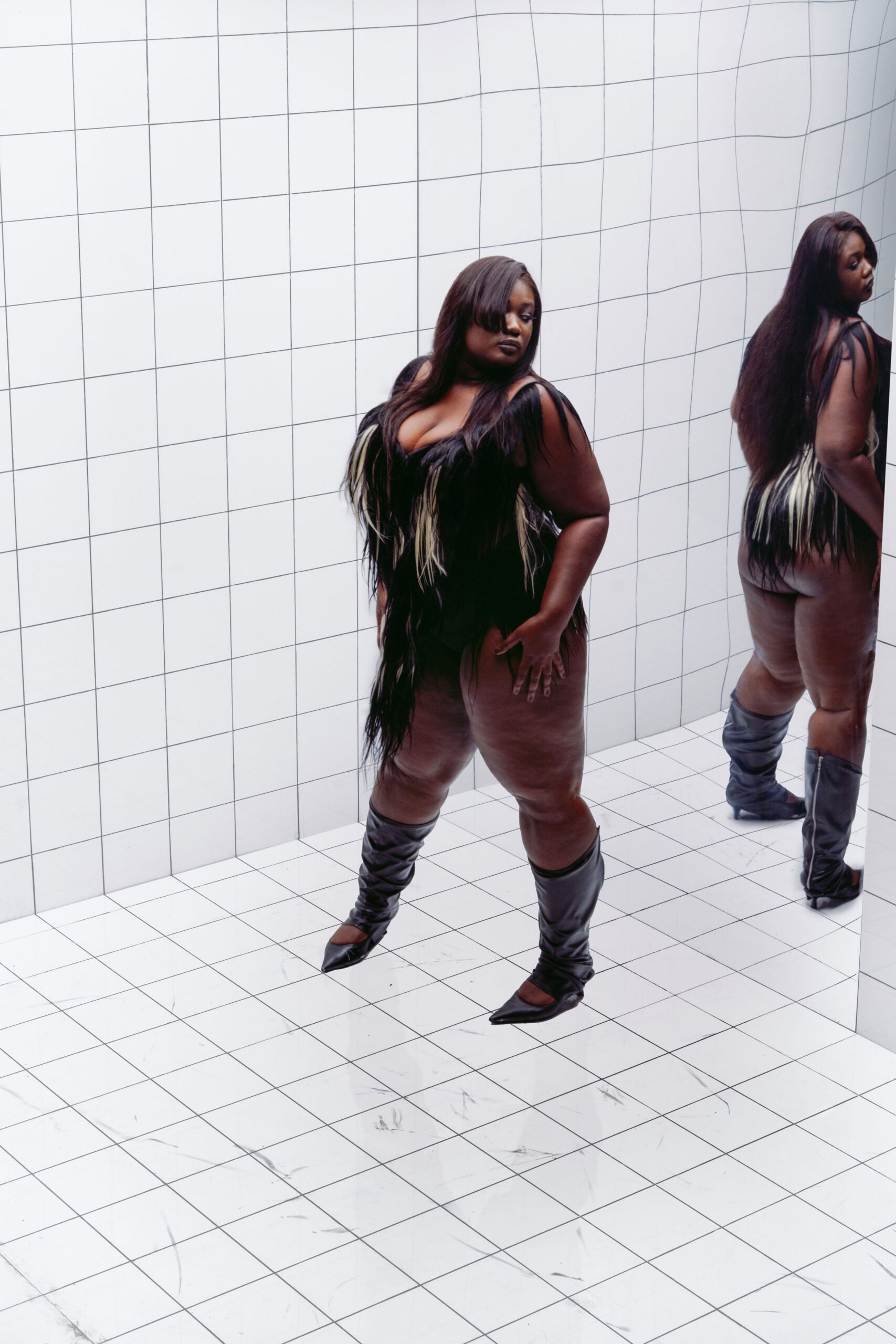black fringed bodysuit with boots