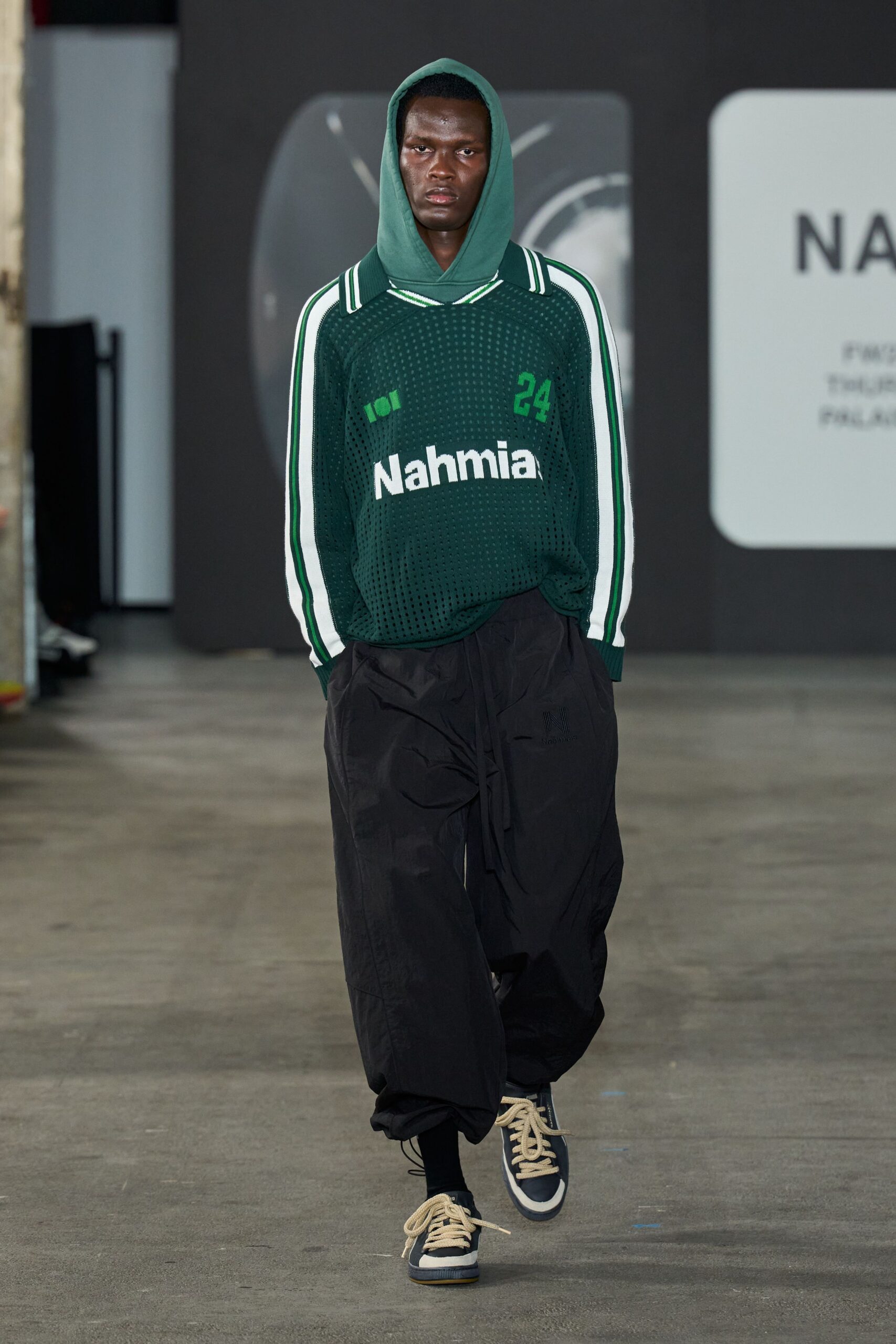 green hoodie black wide-leg pants
