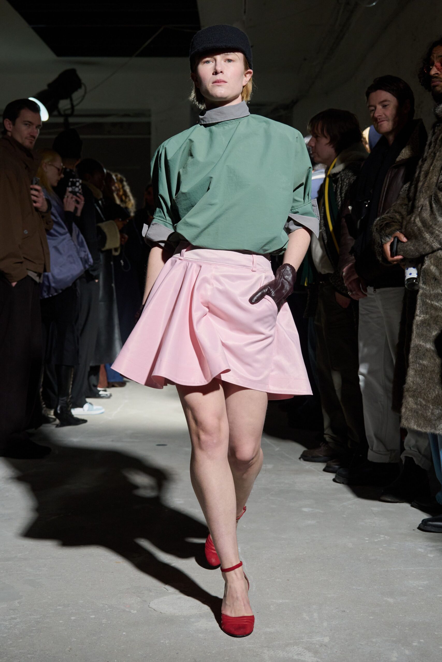 green top pink skirt red shoes