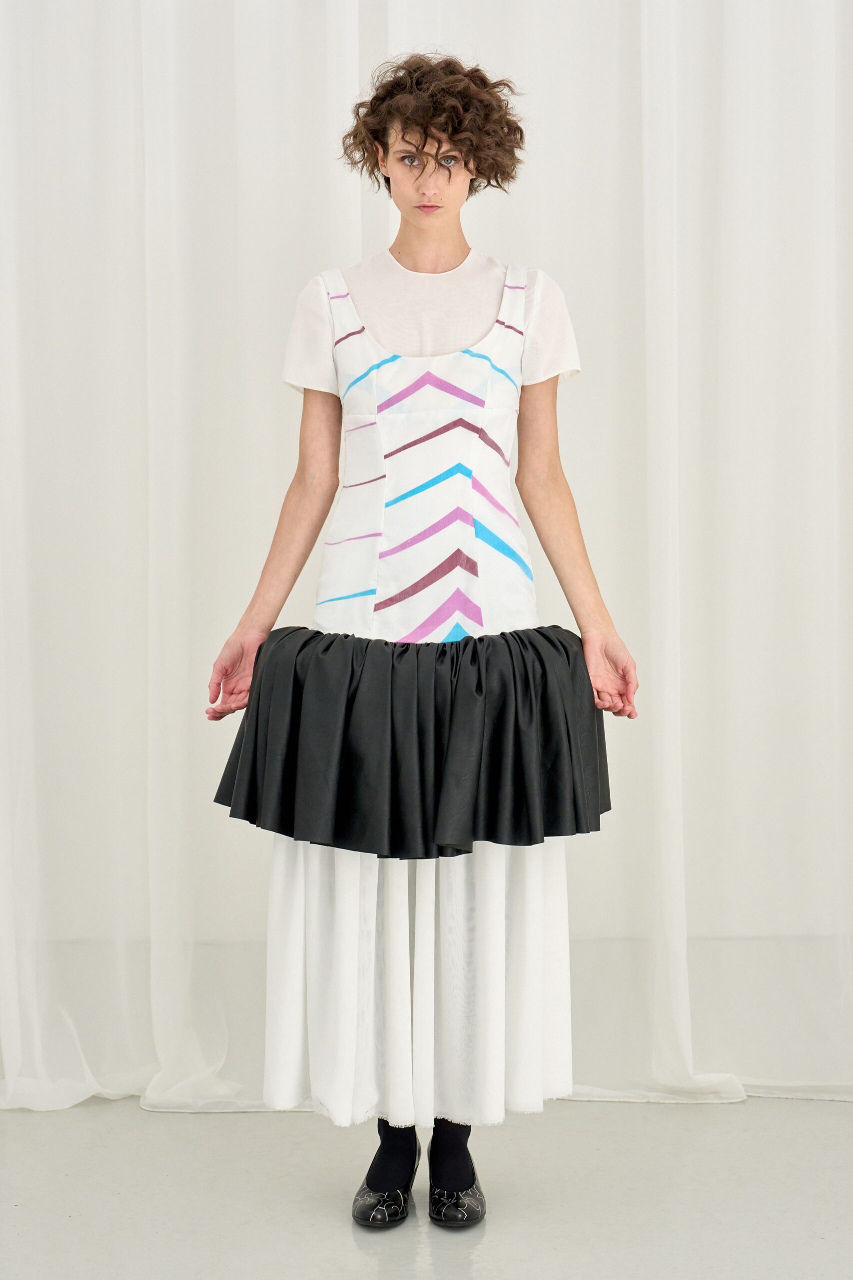 white top with black skirt