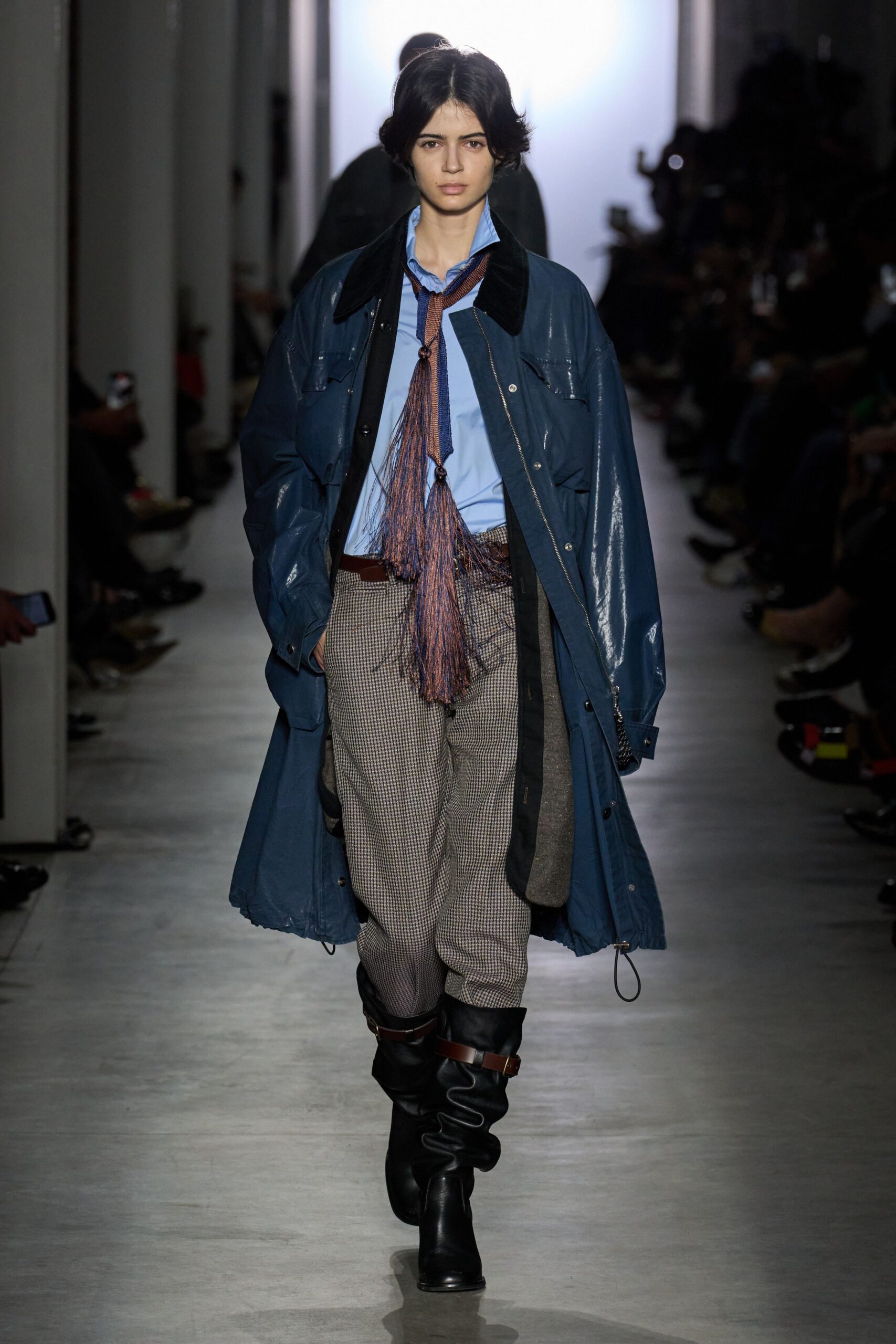 blue vinyl coat with gray striped pants
