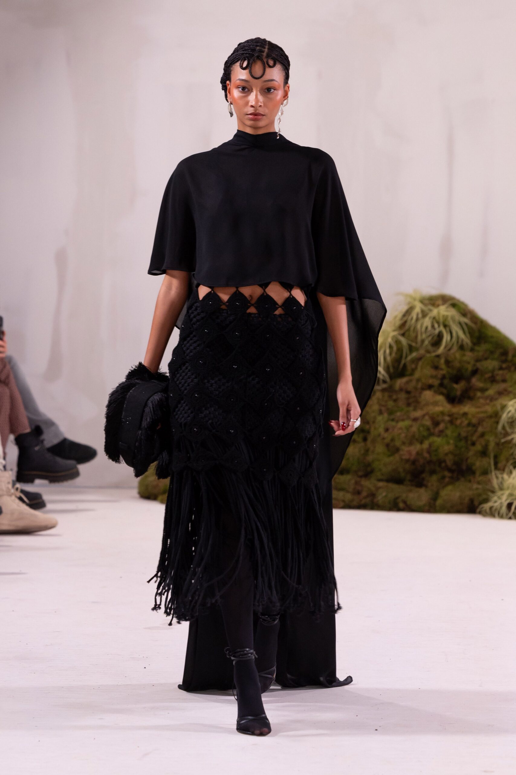 black silk top and fringed skirt