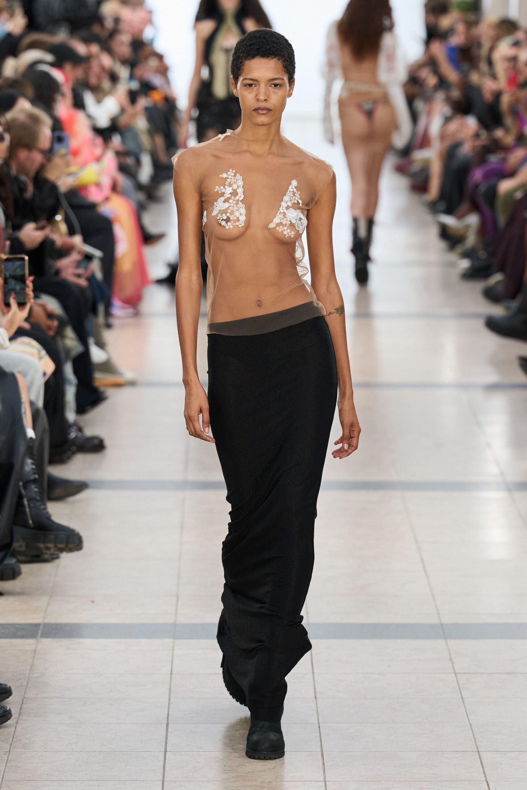sheer embellished top with black skirt