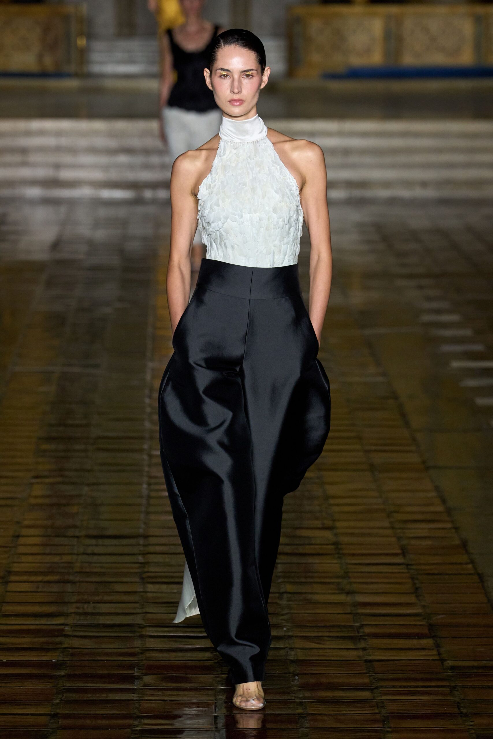 white ruffled top with black pants