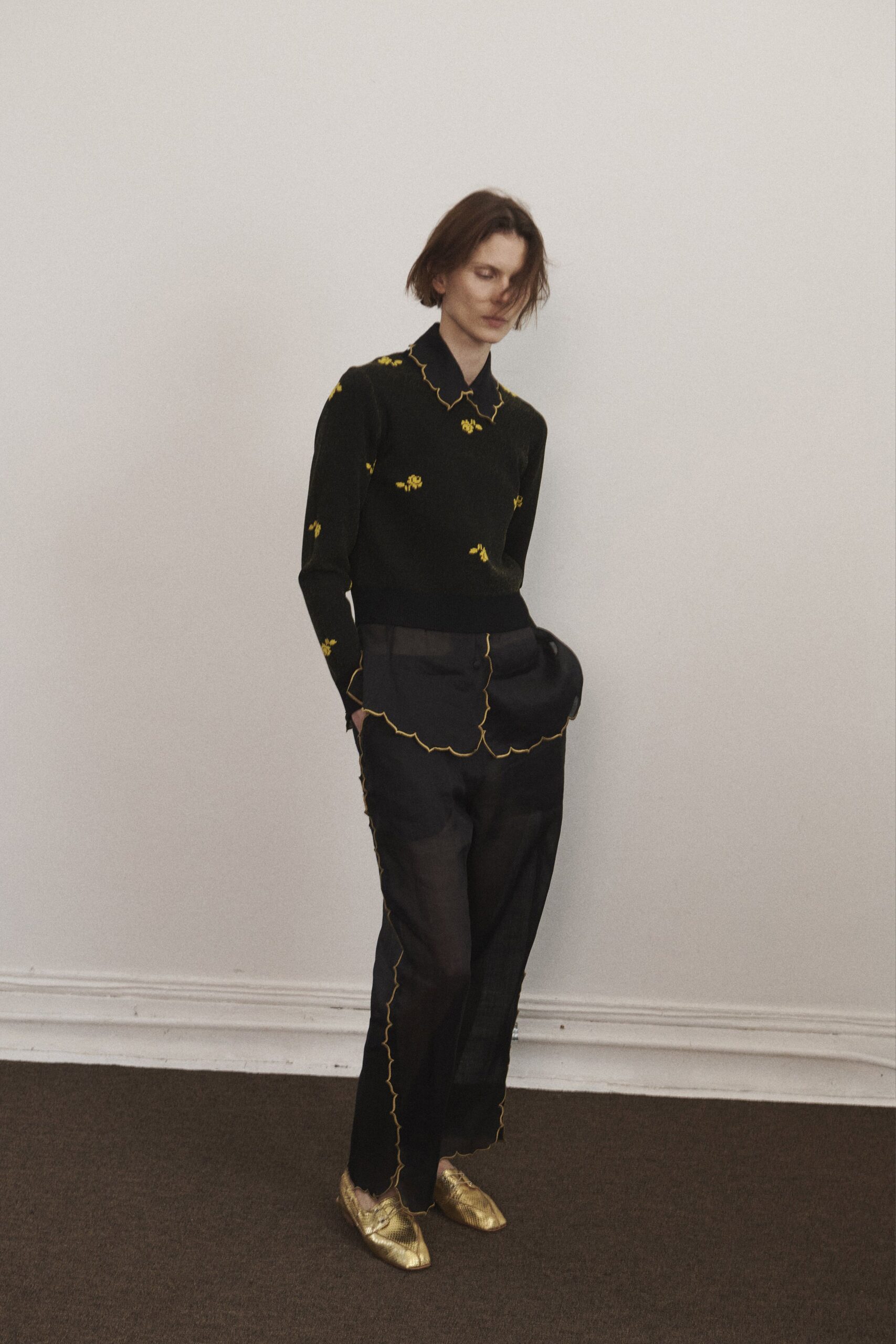 black fitted shirt with gold shoes