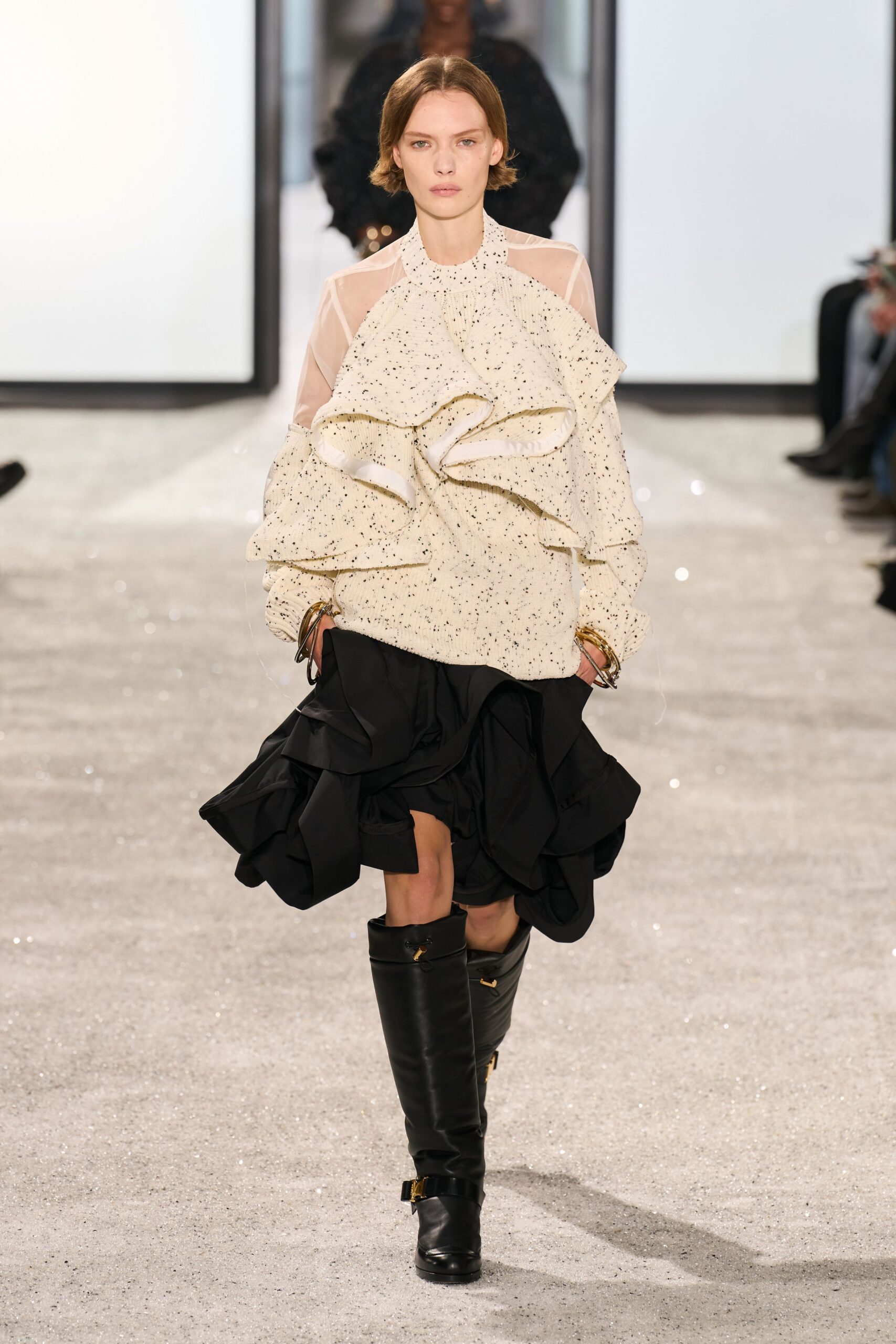 white ruffled blouse black mini skirt