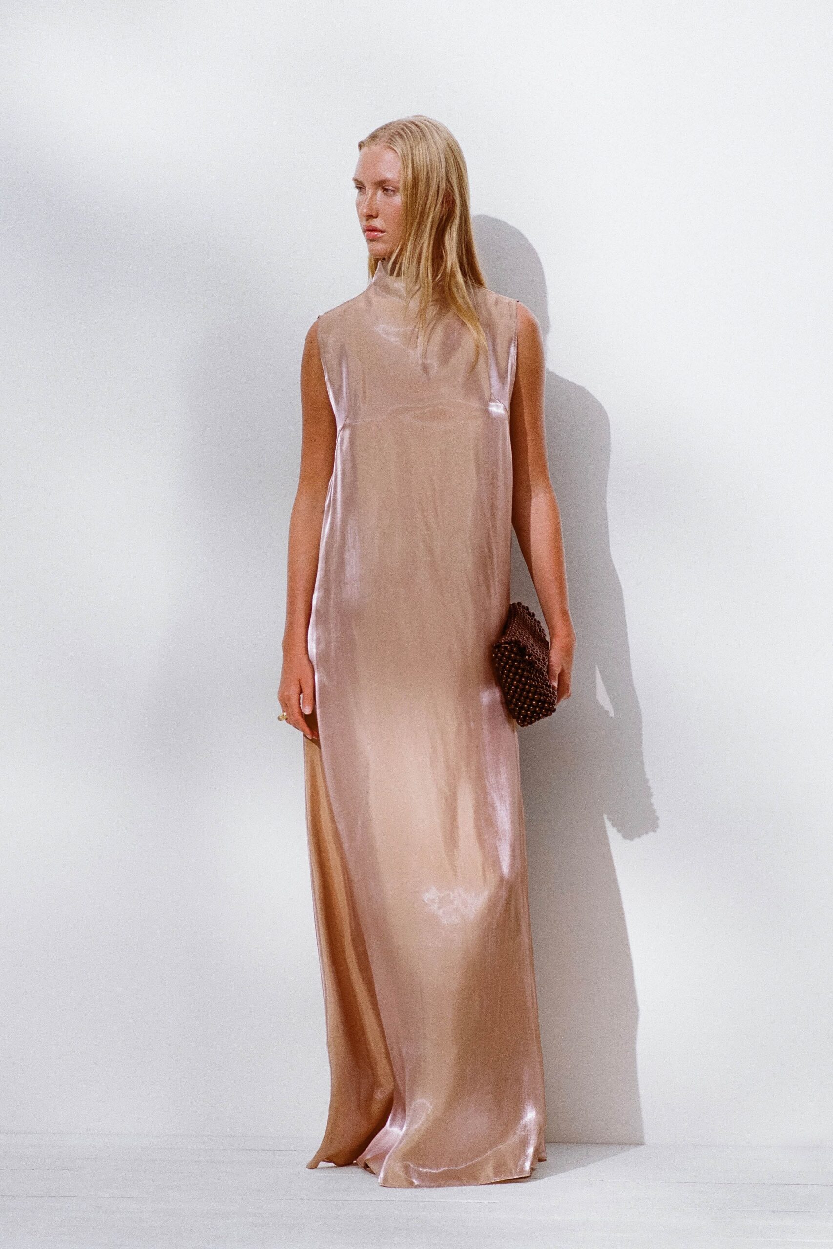 pink silk sleeveless high-neck fitted flowing shiny gown