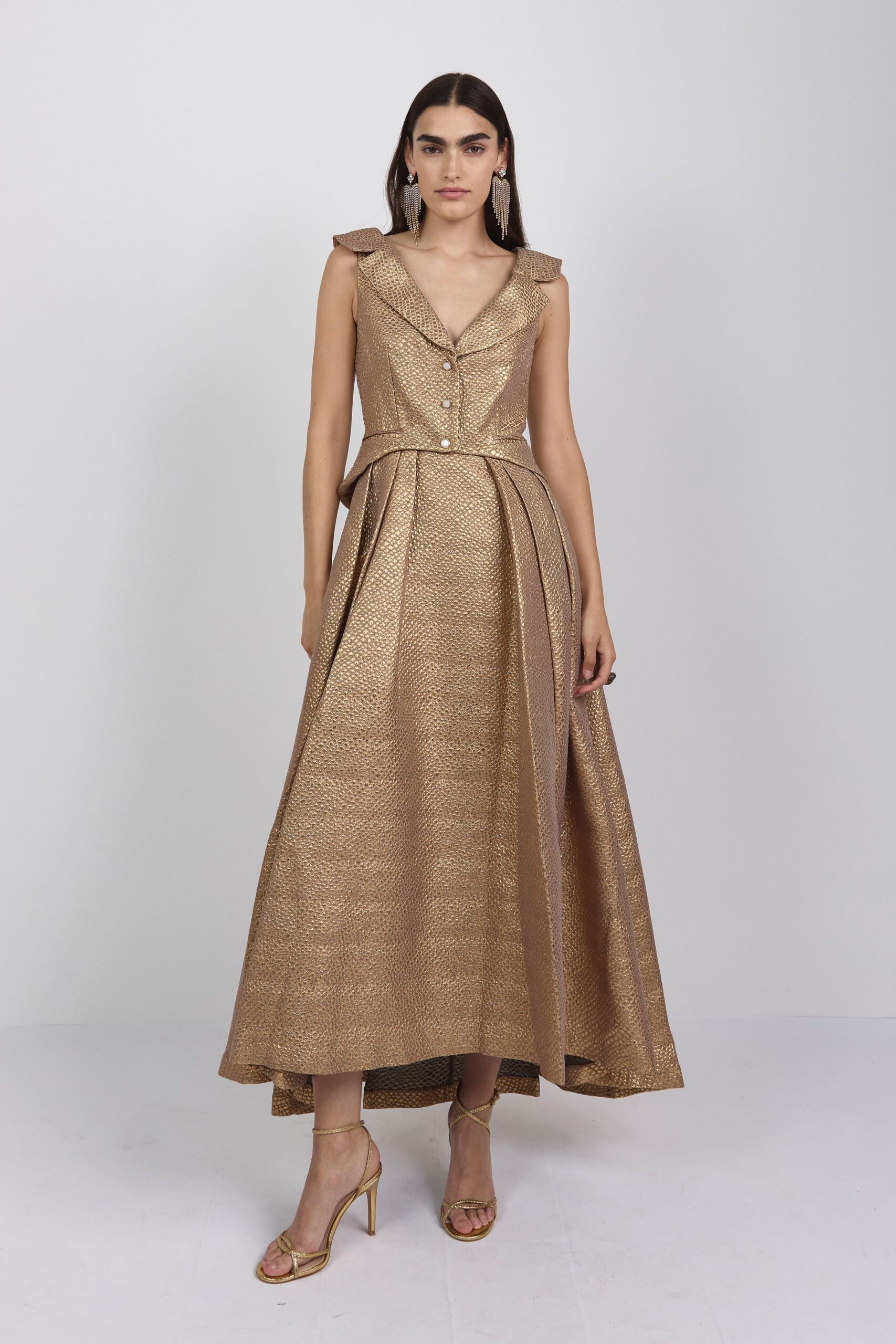 gold silk sleeveless v-neck fitted pleated belted gown
