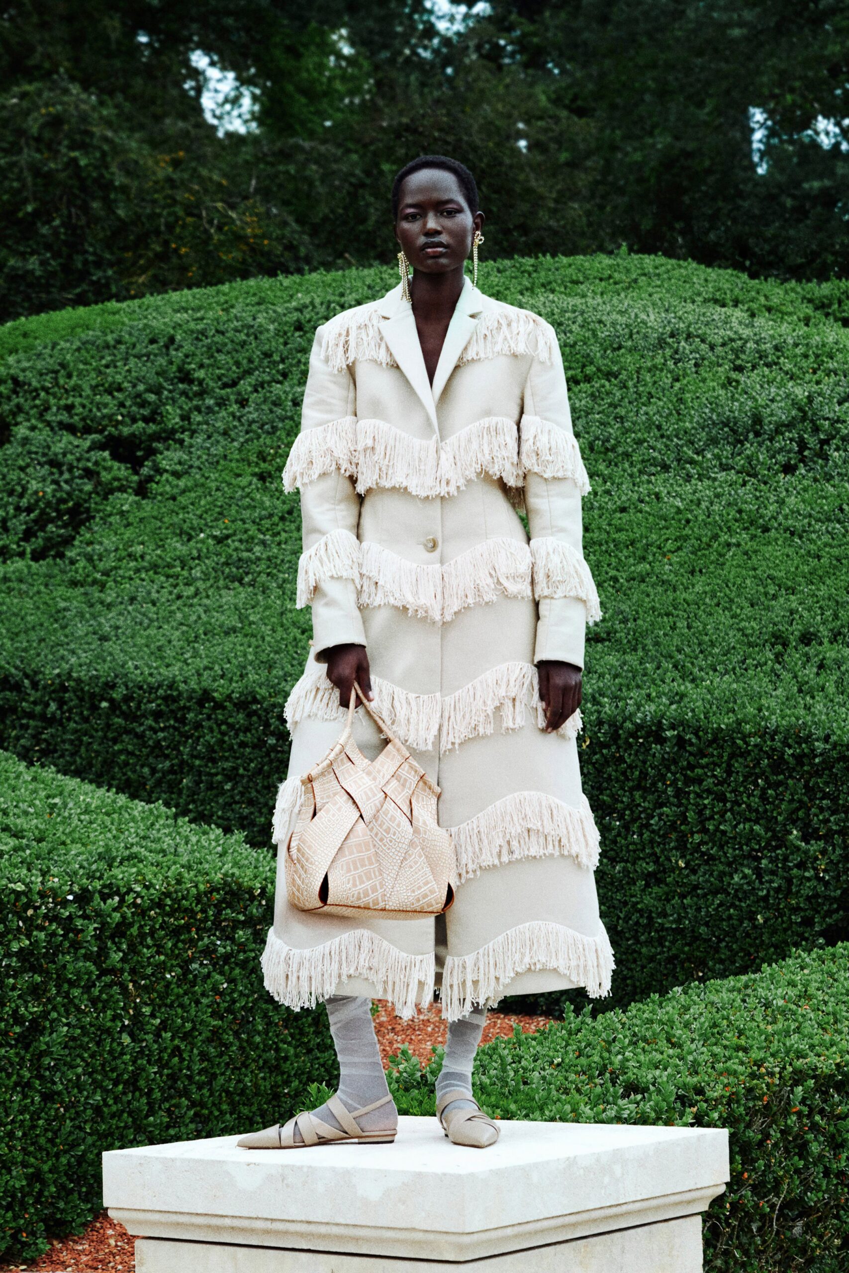 beige fringed coat with bag