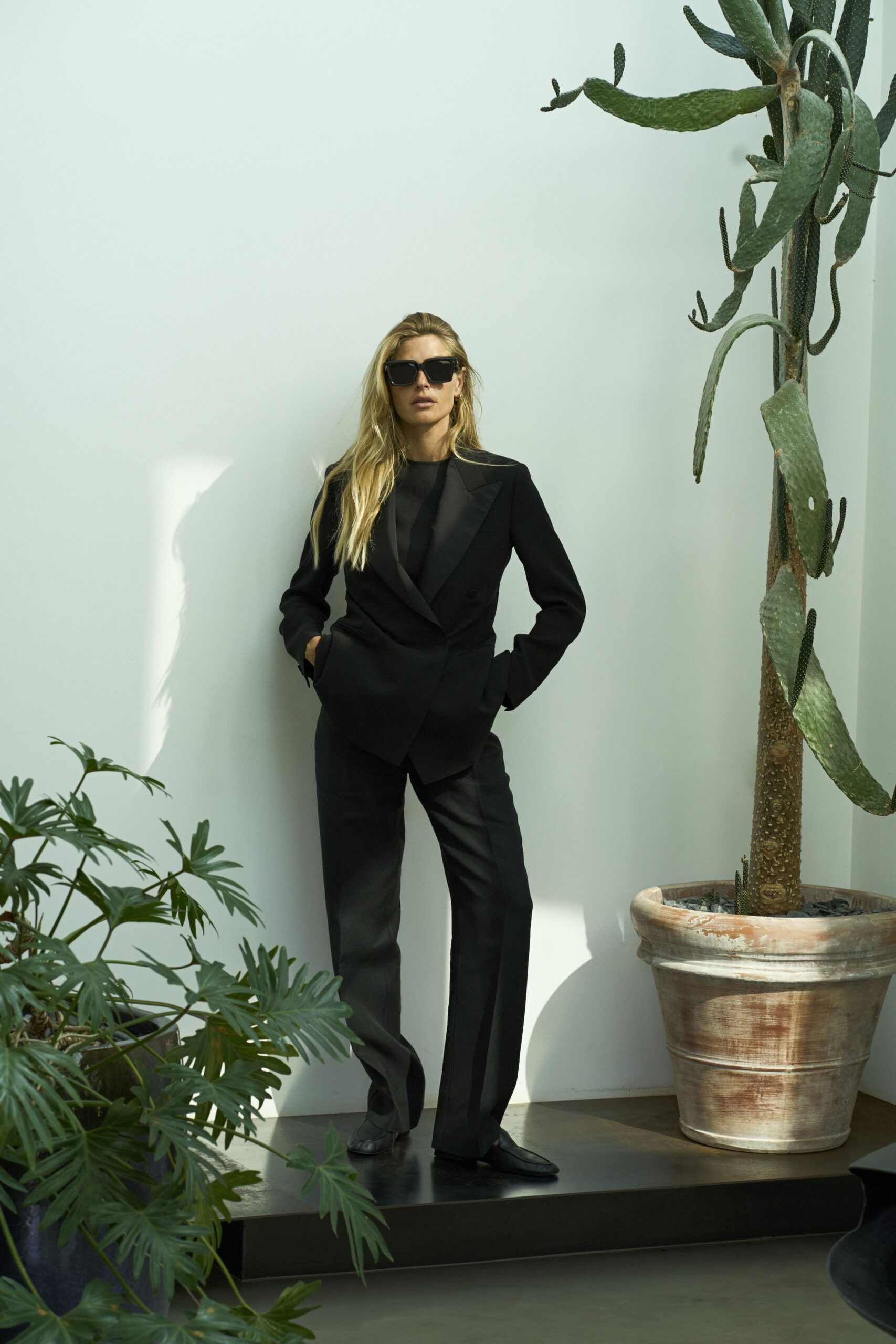 black tailored suit with sunglasses