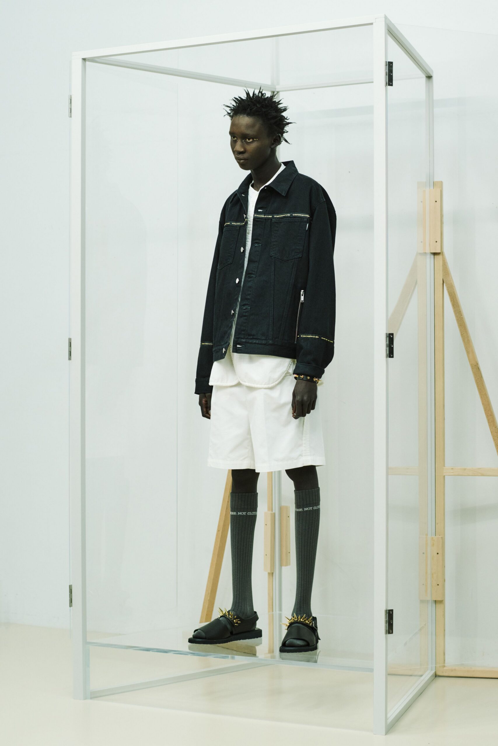 black denim jacket with white shorts