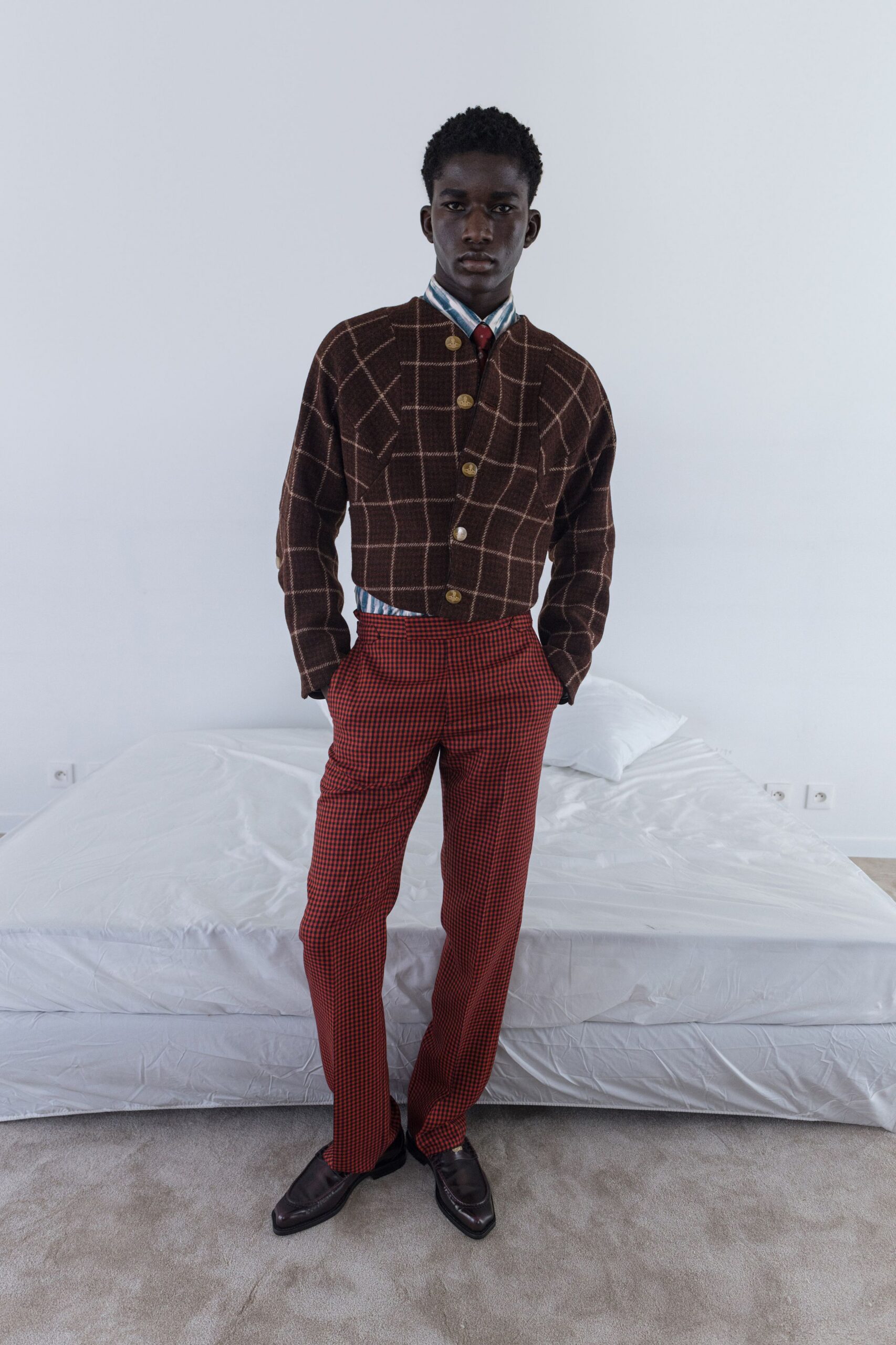 brown checked jacket with red pants