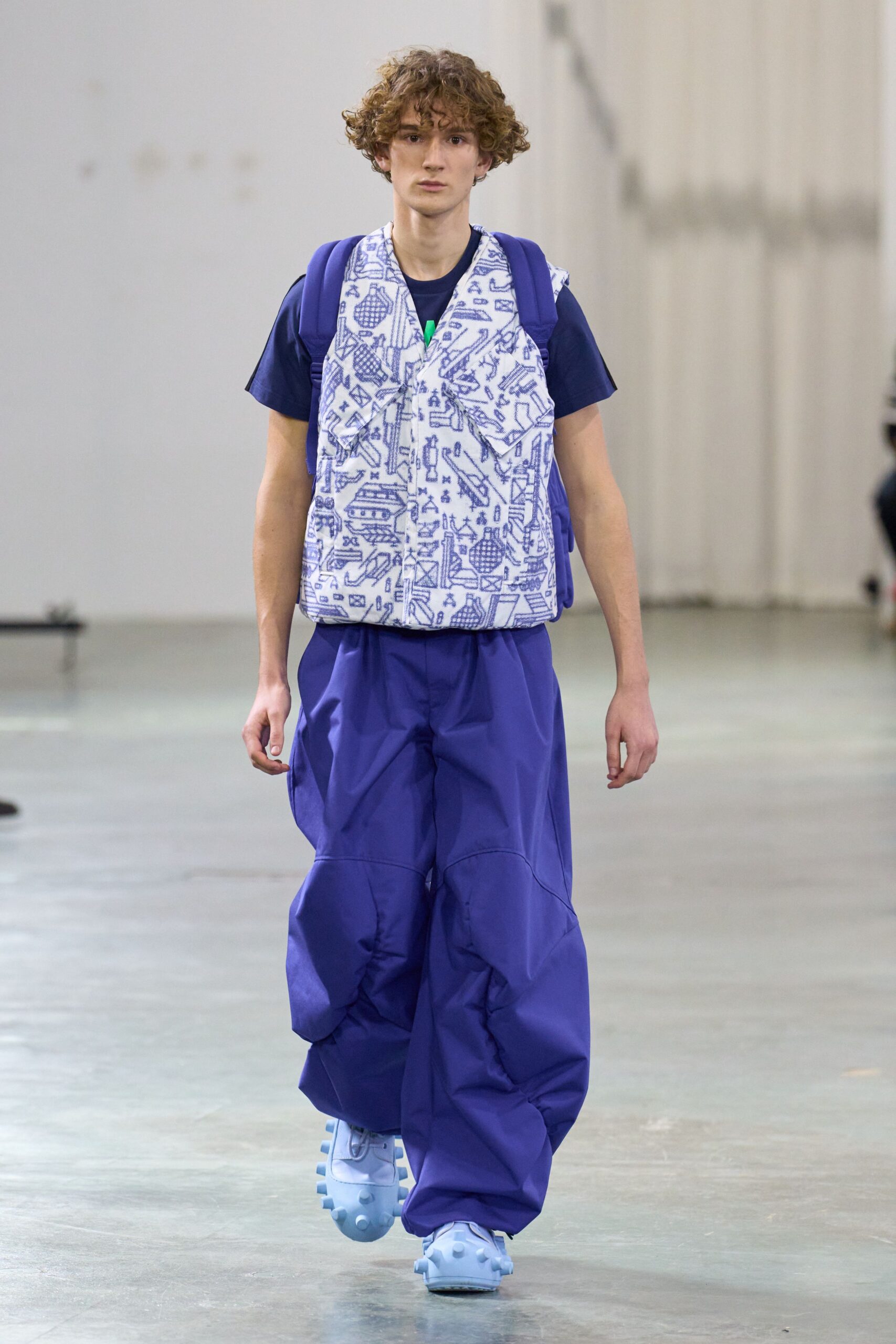 blue printed vest with black t-shirt