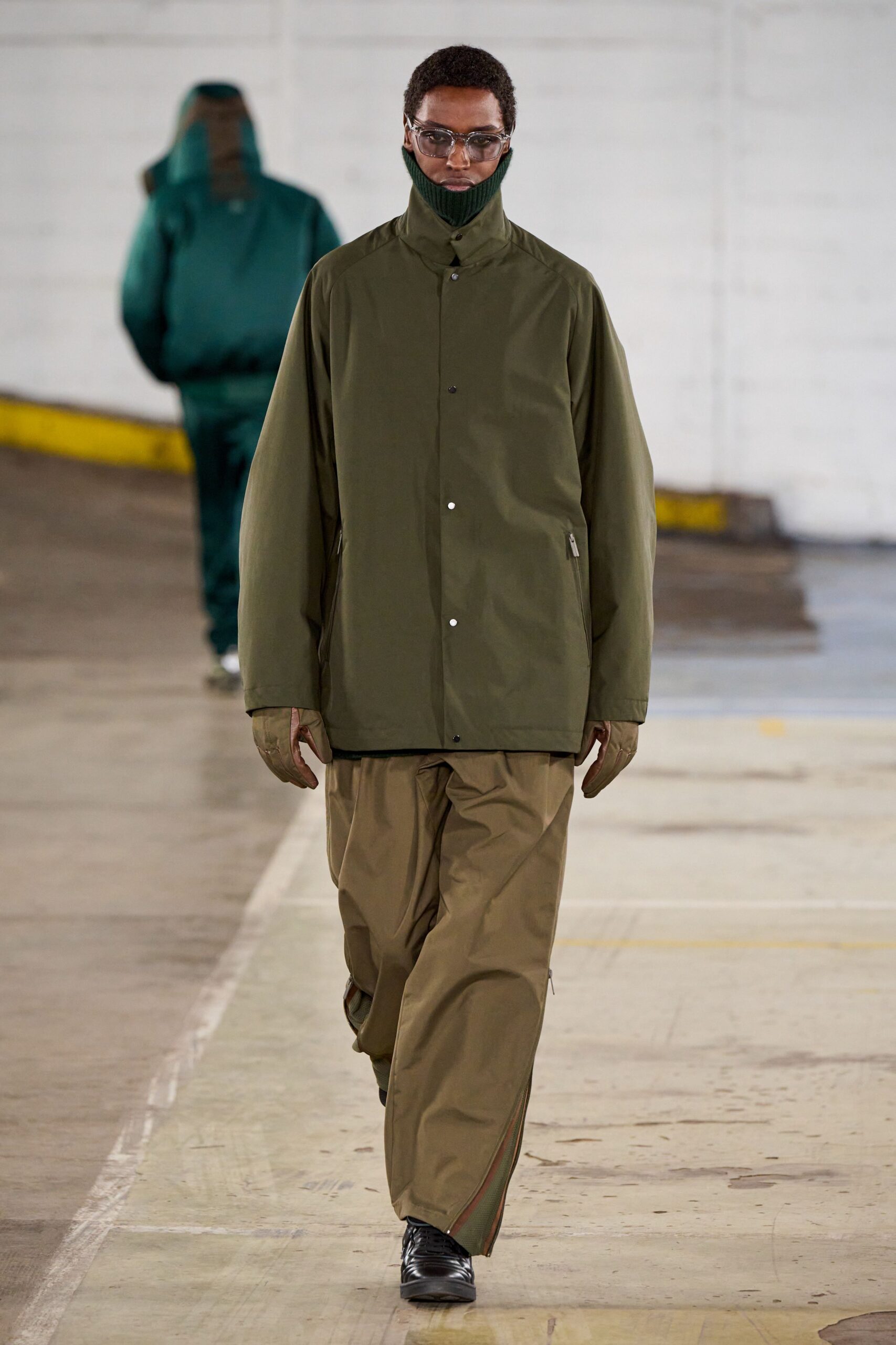green oversized jacket and beige pants