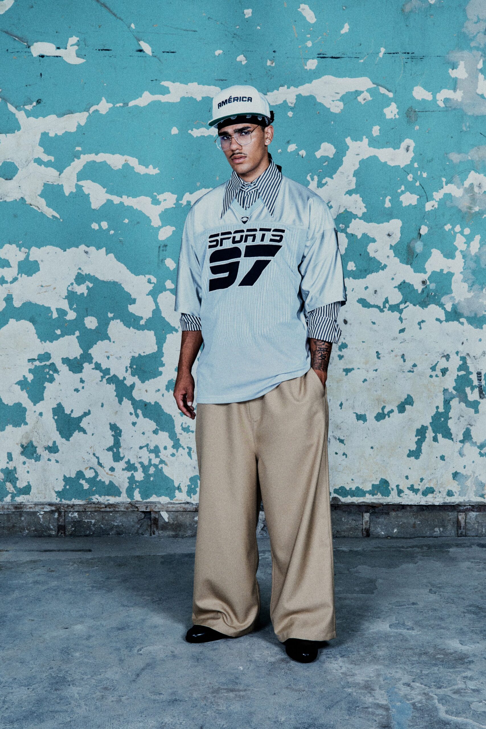 light blue printed shirt with beige pants