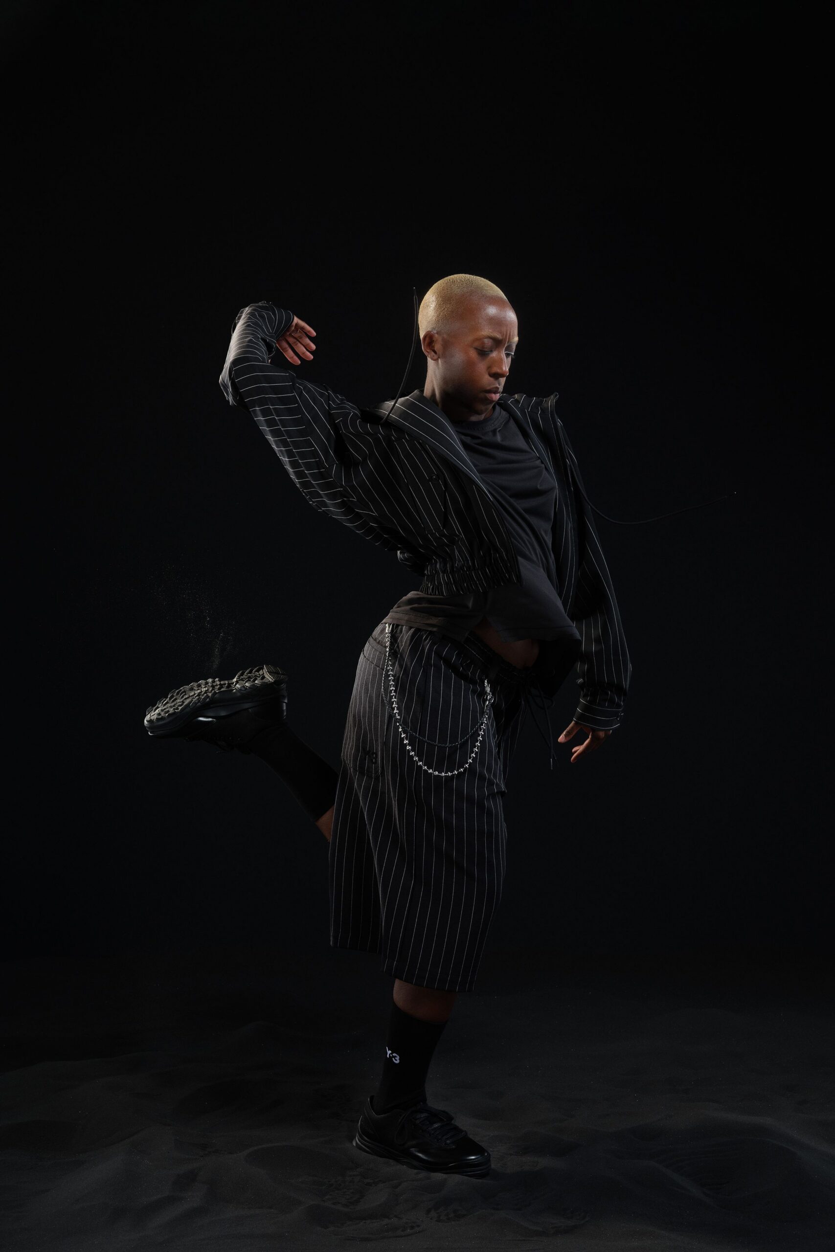 black relaxed jacket with pleated skirt