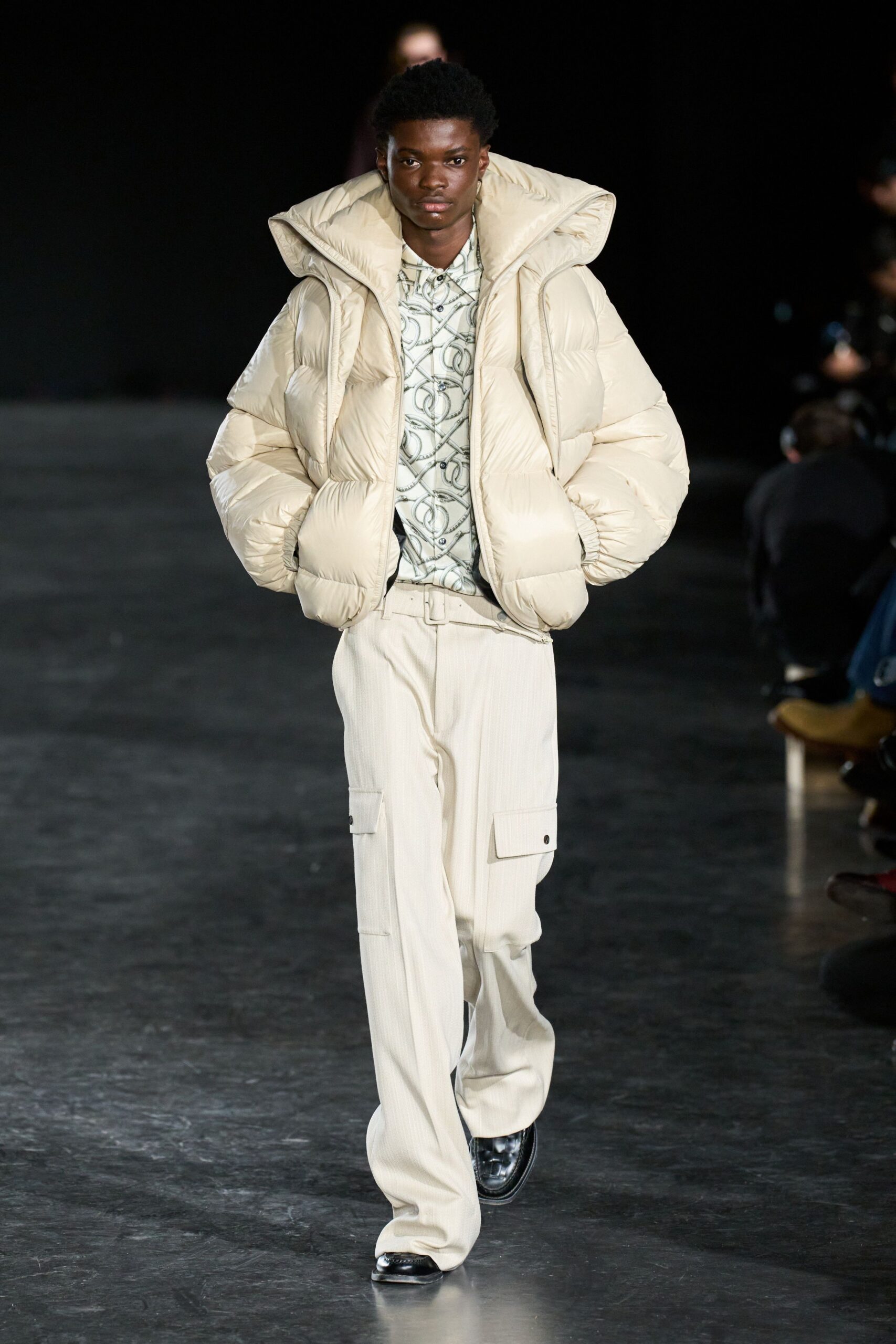 beige padded jacket with printed shirt