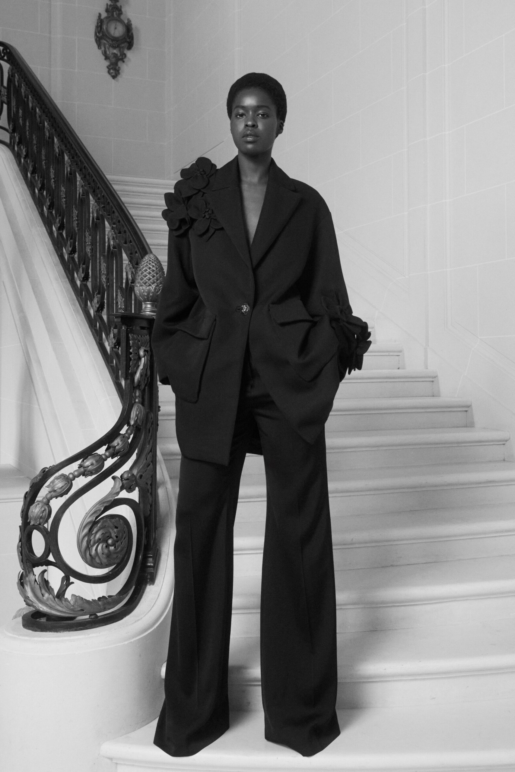 black wool long-sleeve collared oversized pleated blazer