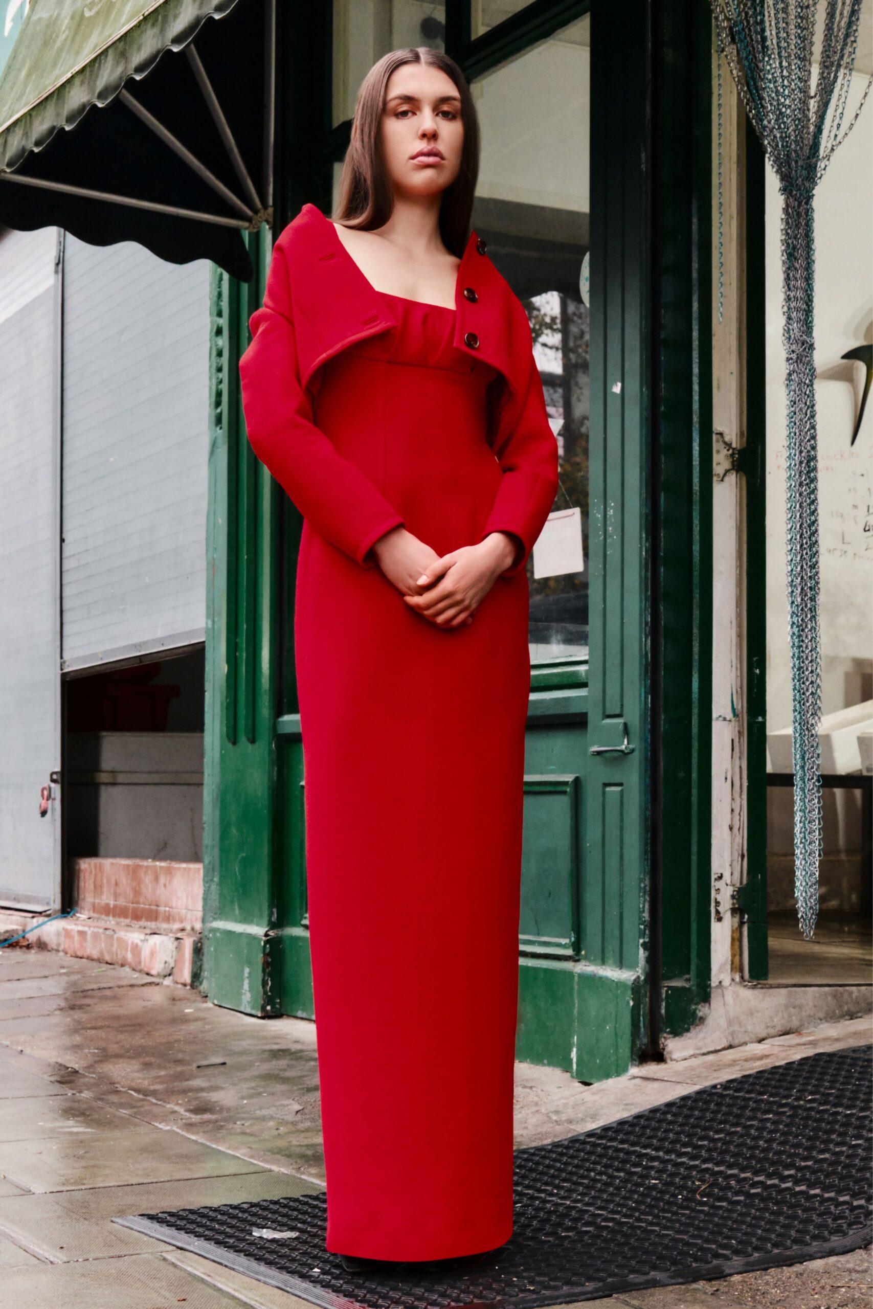 red cotton long-sleeve collared structured buttoned coat
