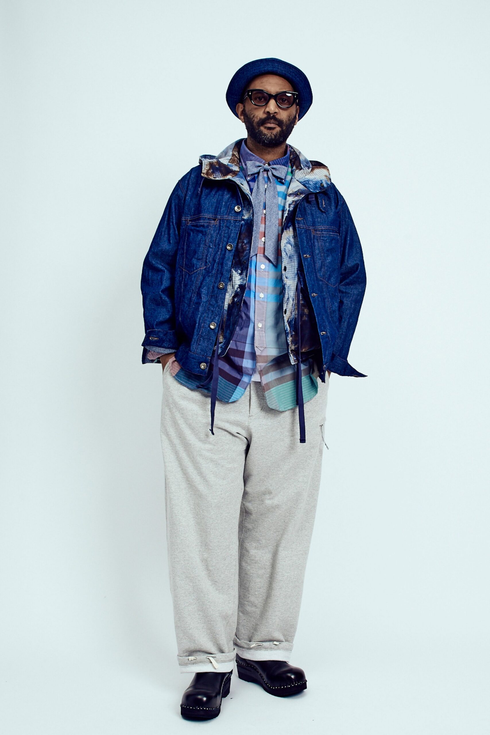 blue denim jacket with multi-colored shirt