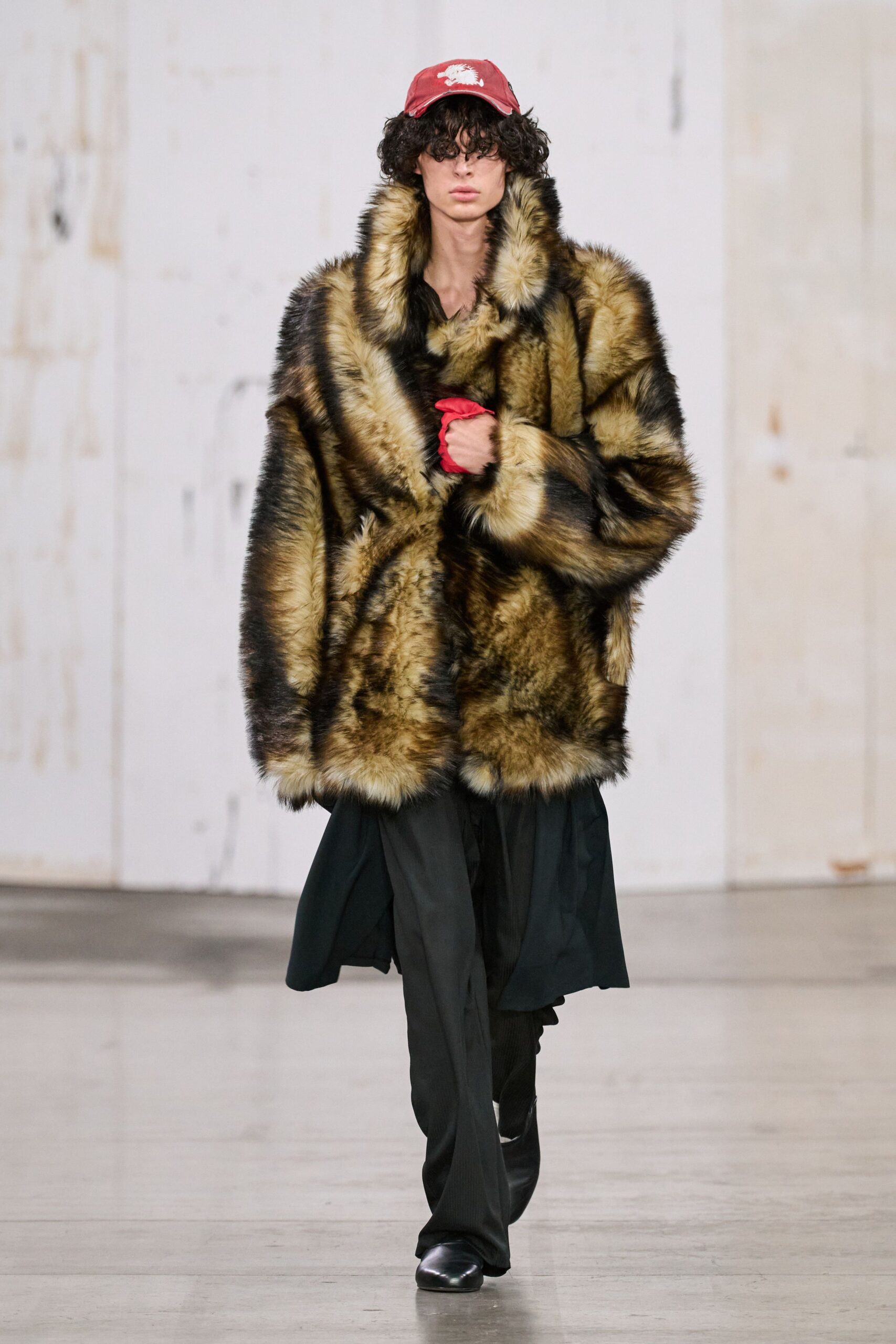 brown faux-fur coat with black pants