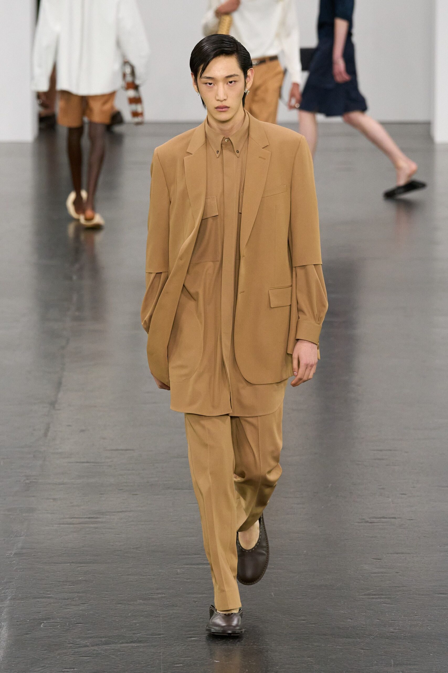 beige relaxed suit with brown shoes