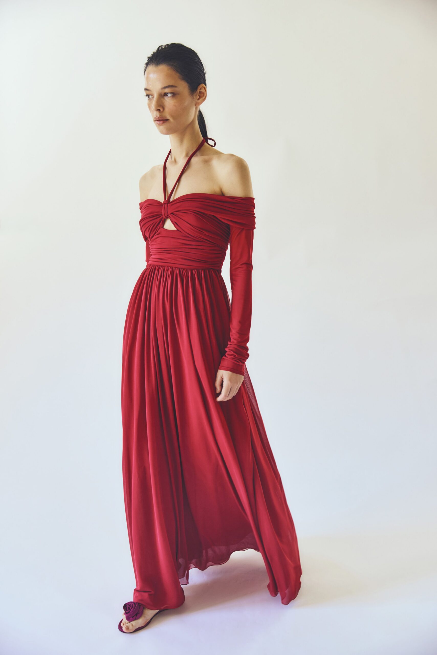 red silk off-shoulder long-sleeve fitted ruched flowing gown