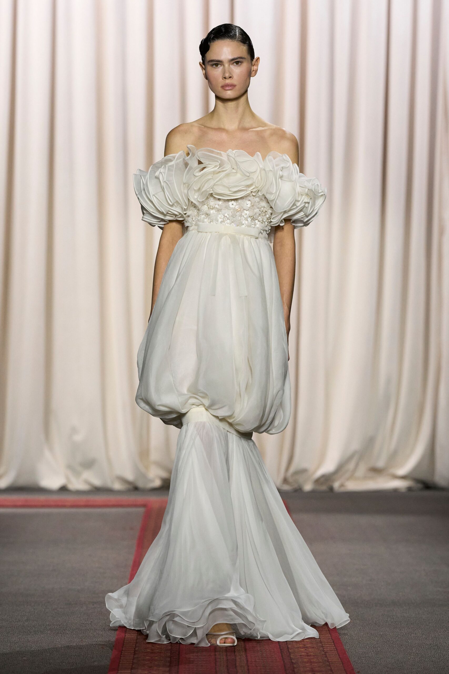 white chiffon off-shoulder fitted pleated draped flowing gown