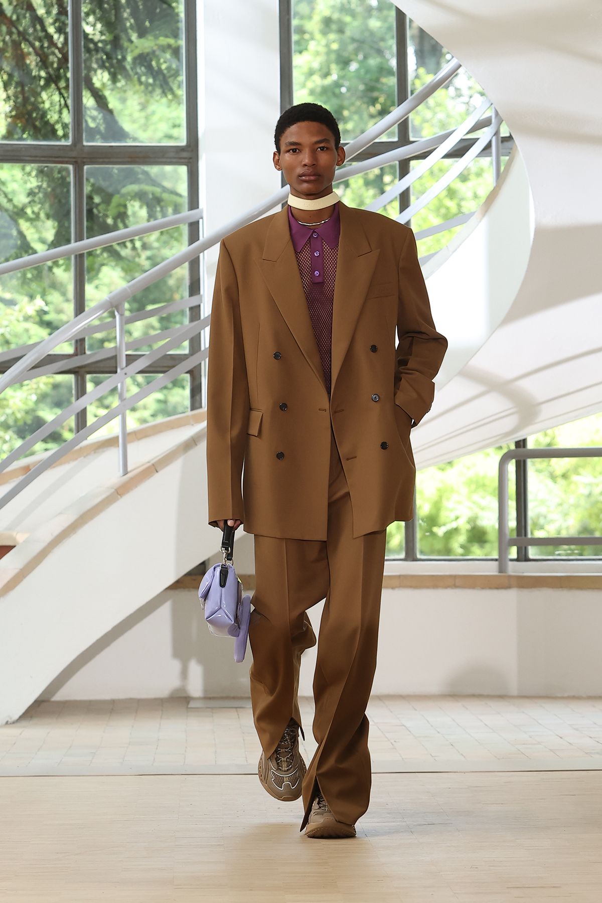 brown tailored suit with purple shirt