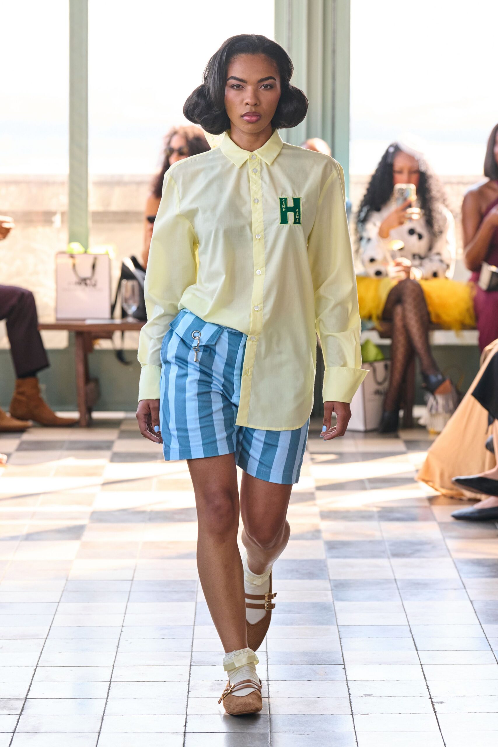yellow collared shirt with blue shorts