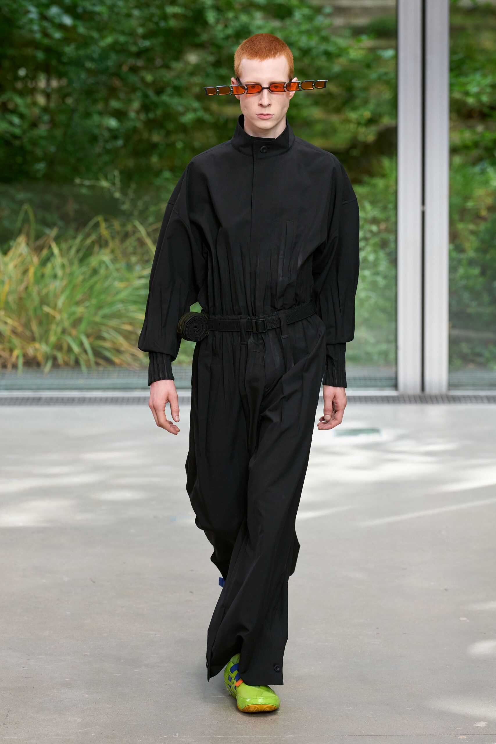 black fitted jumpsuit with green shoes
