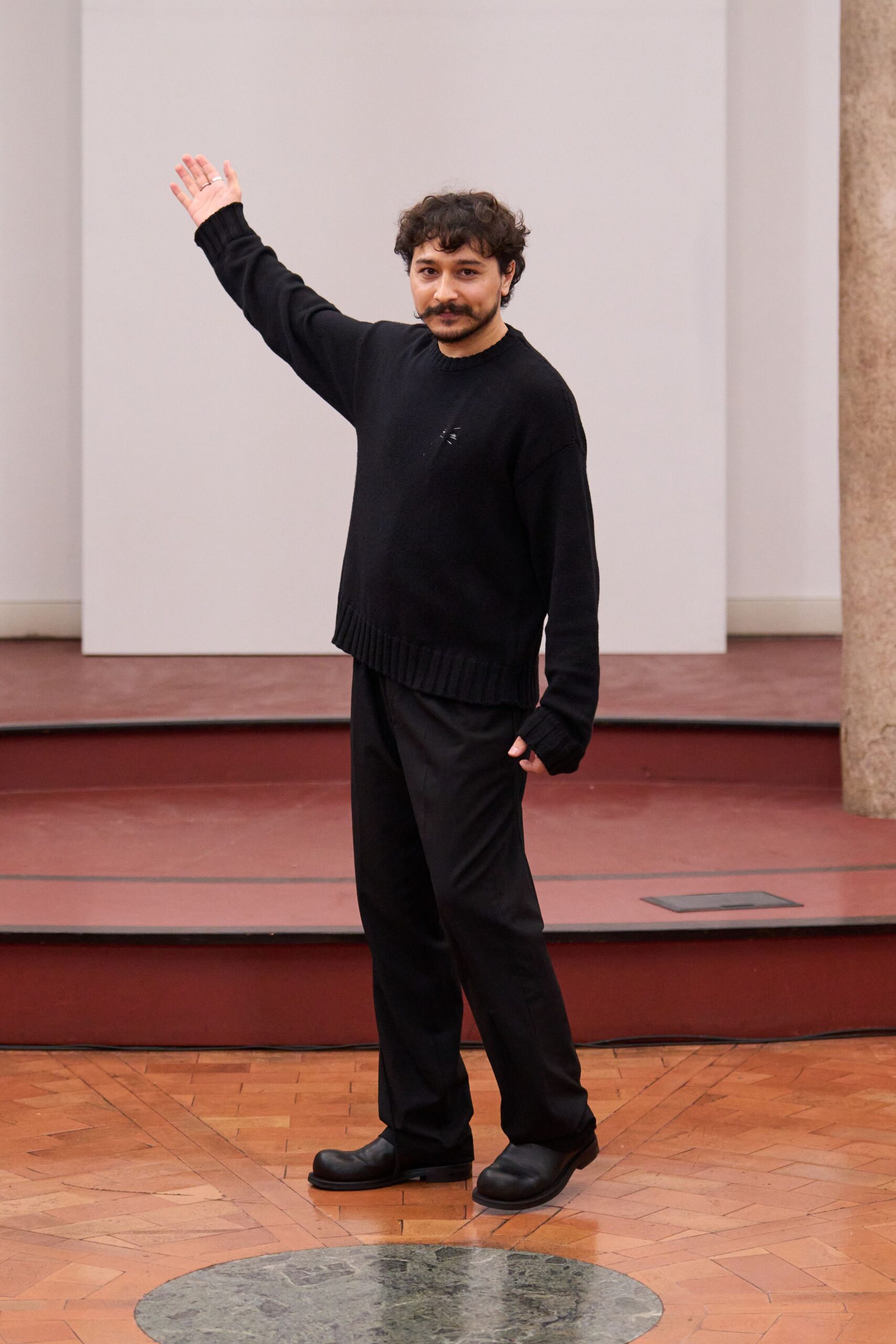 black wool sweater and tailored pants
