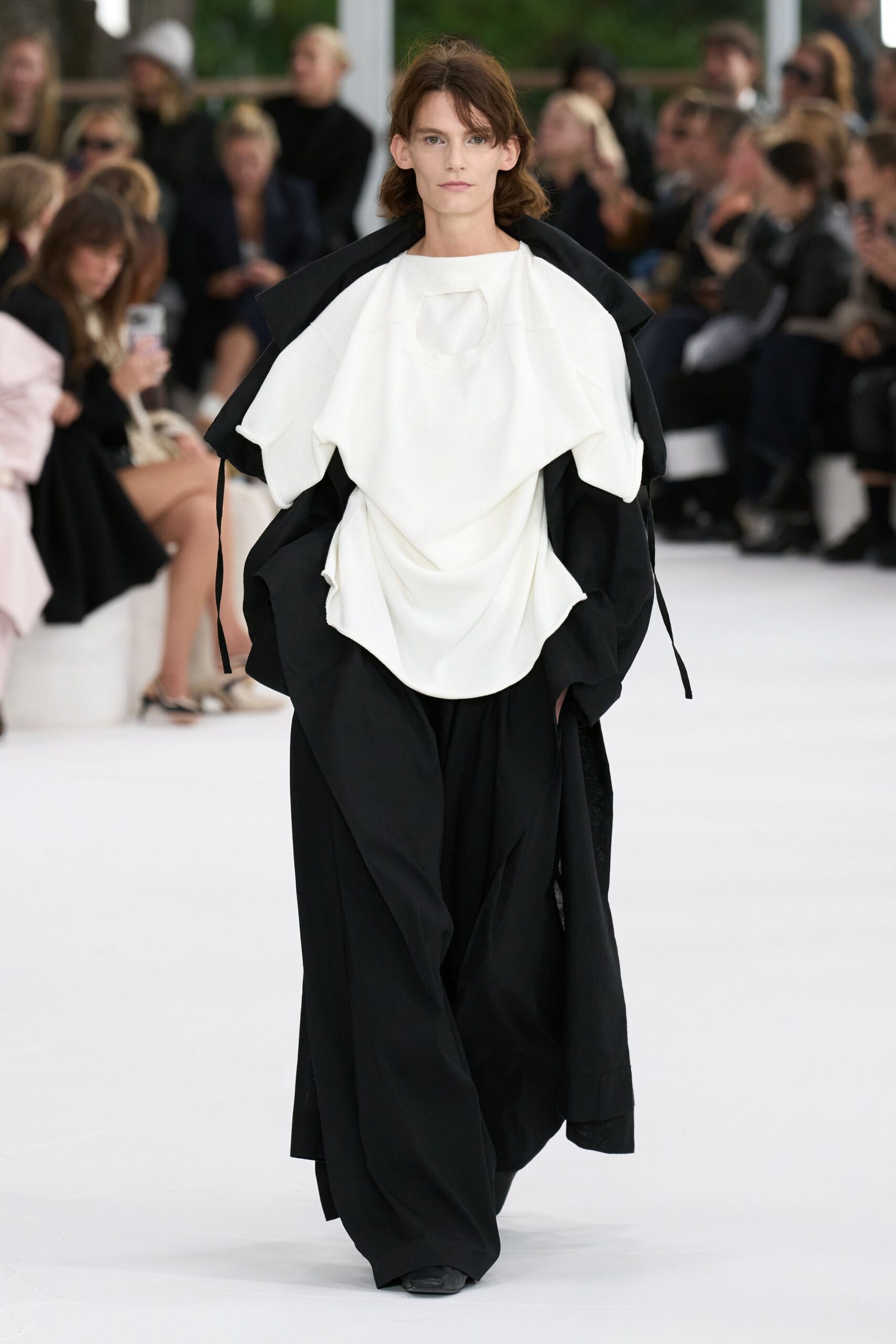 black coat white top relaxed pants