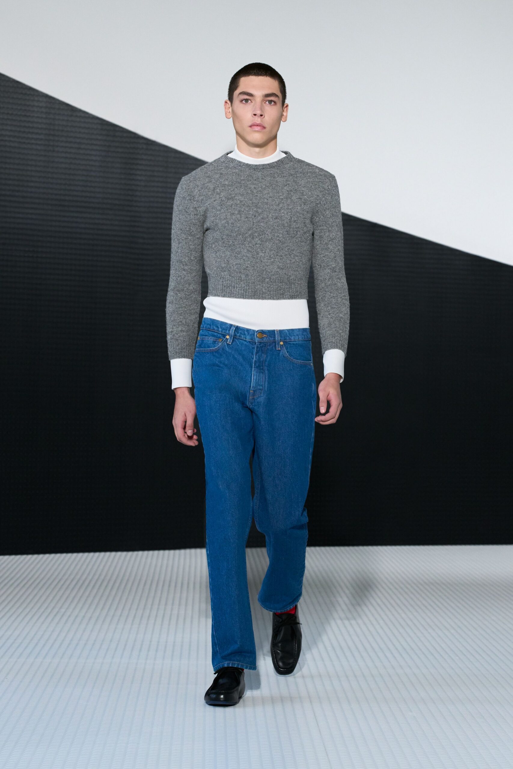 gray fitted sweater blue jeans