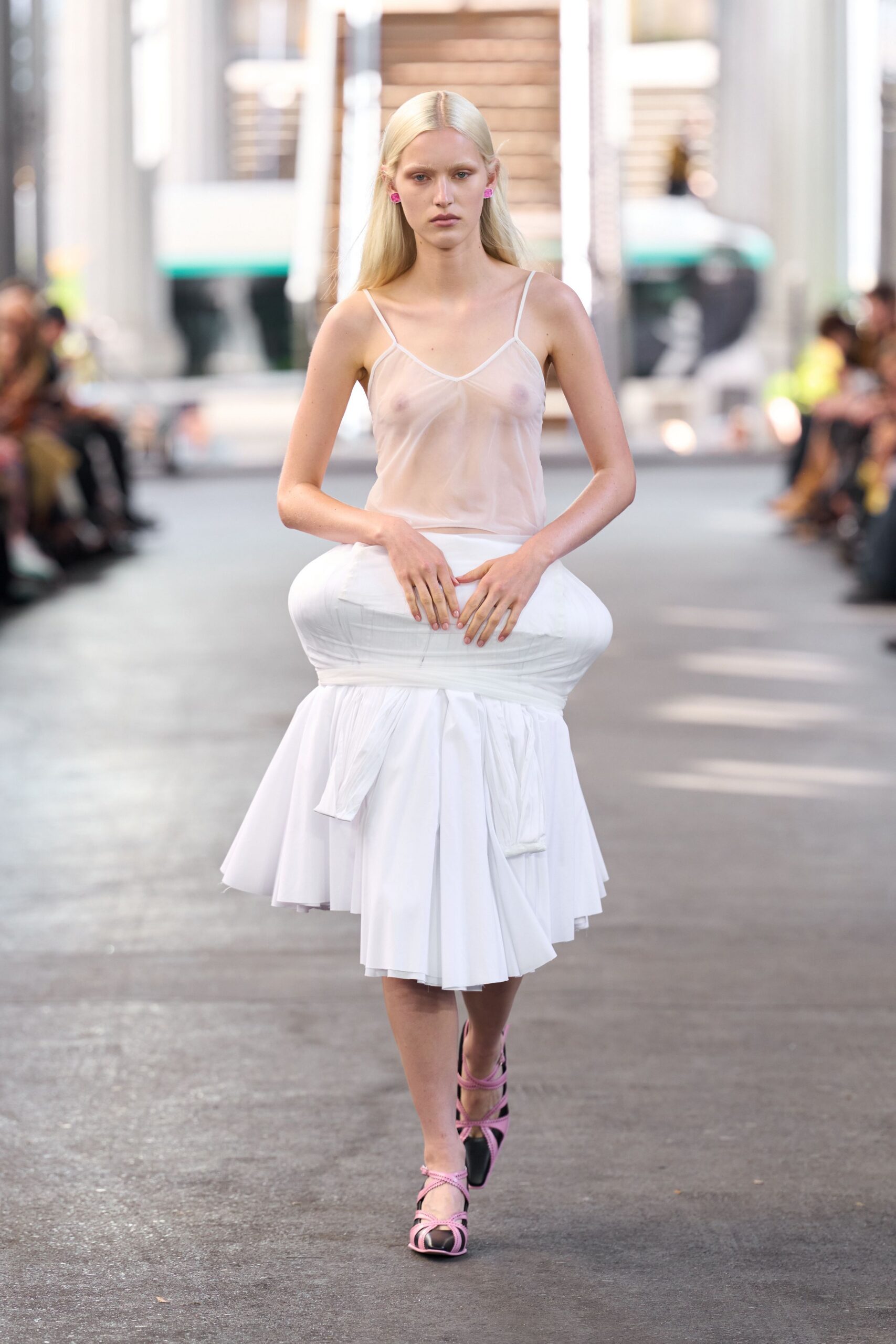 white sheer top and pleated skirt