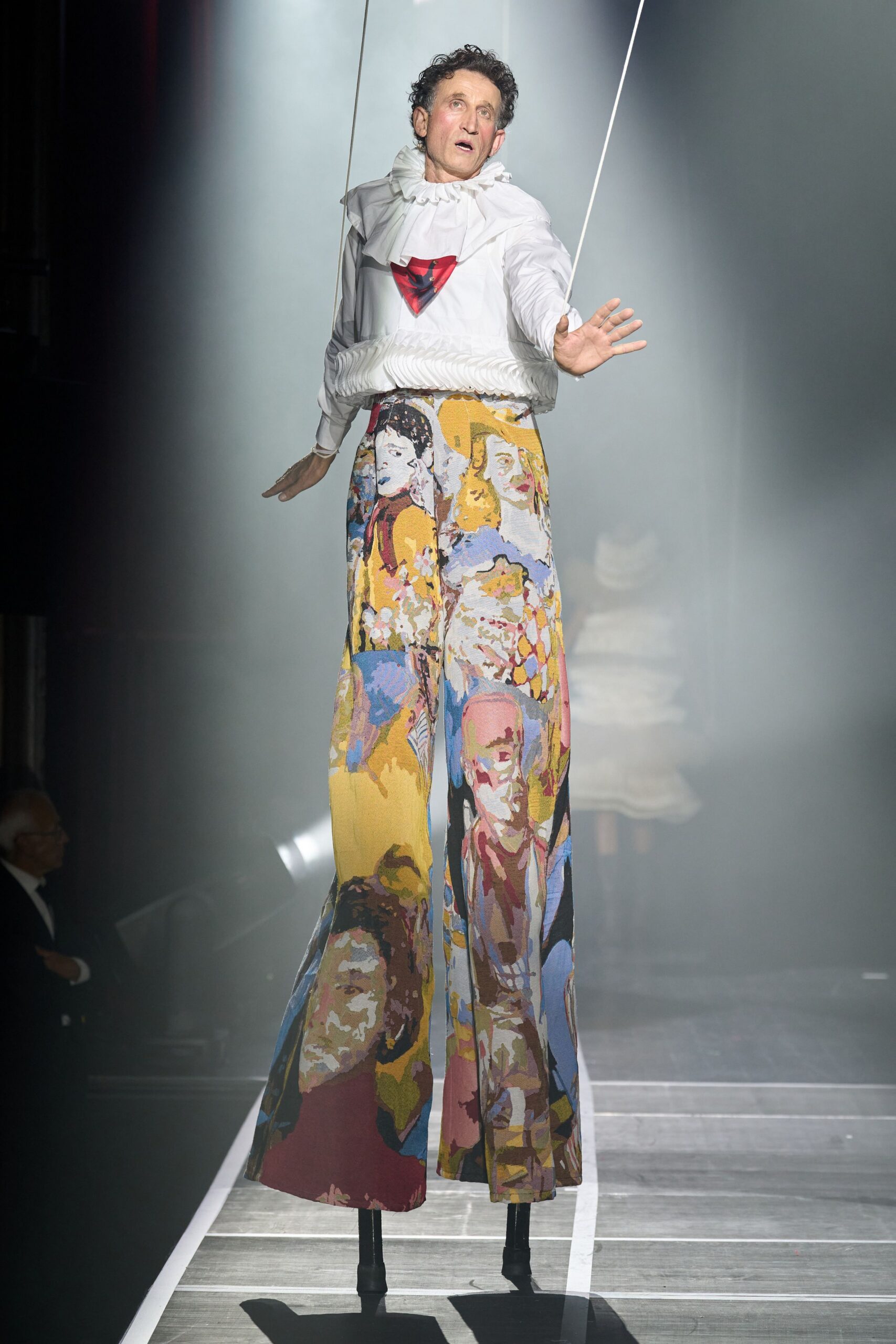 white ruffled top with multi wide-leg pants