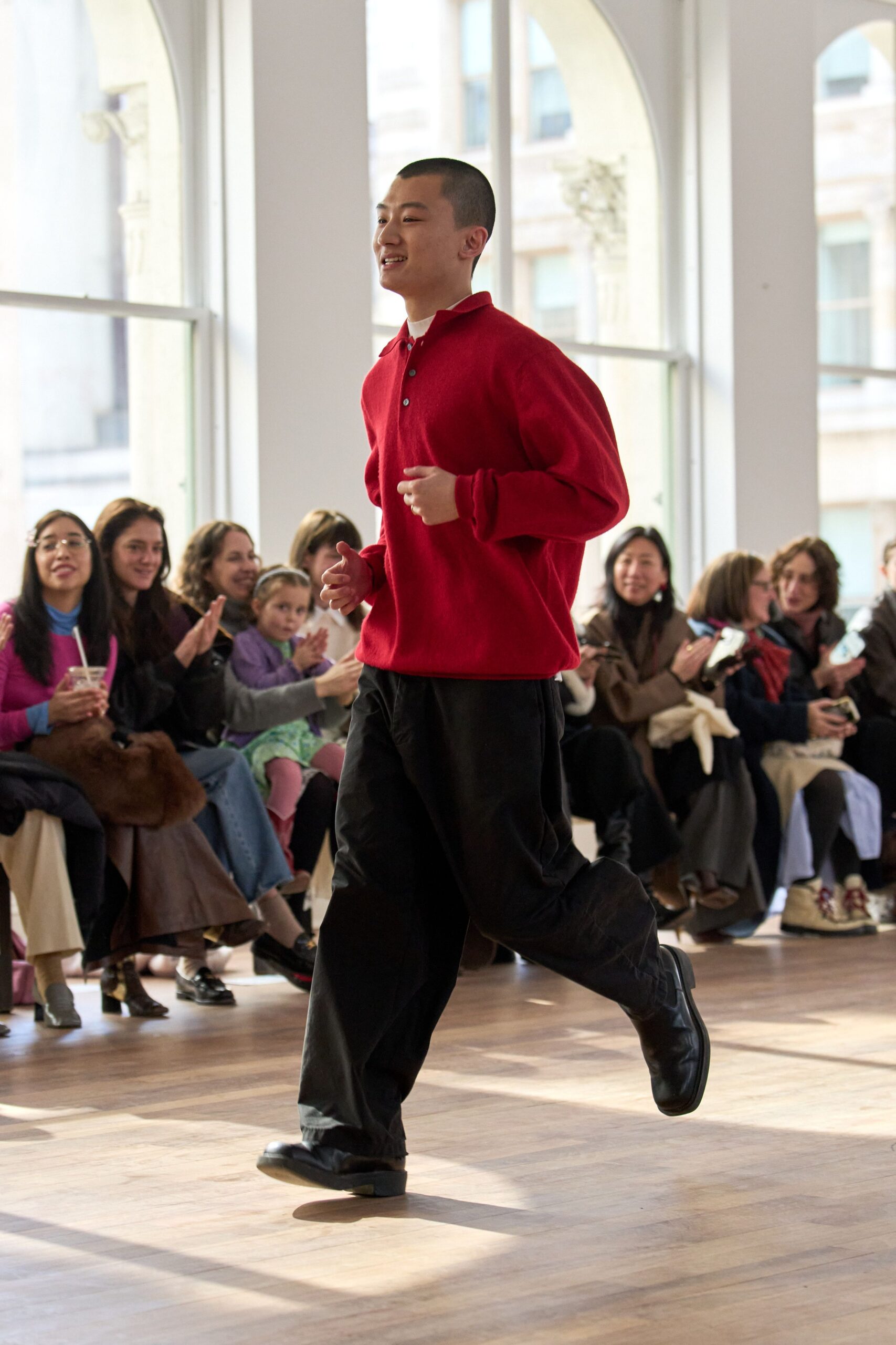 red relaxed sweater with black pants