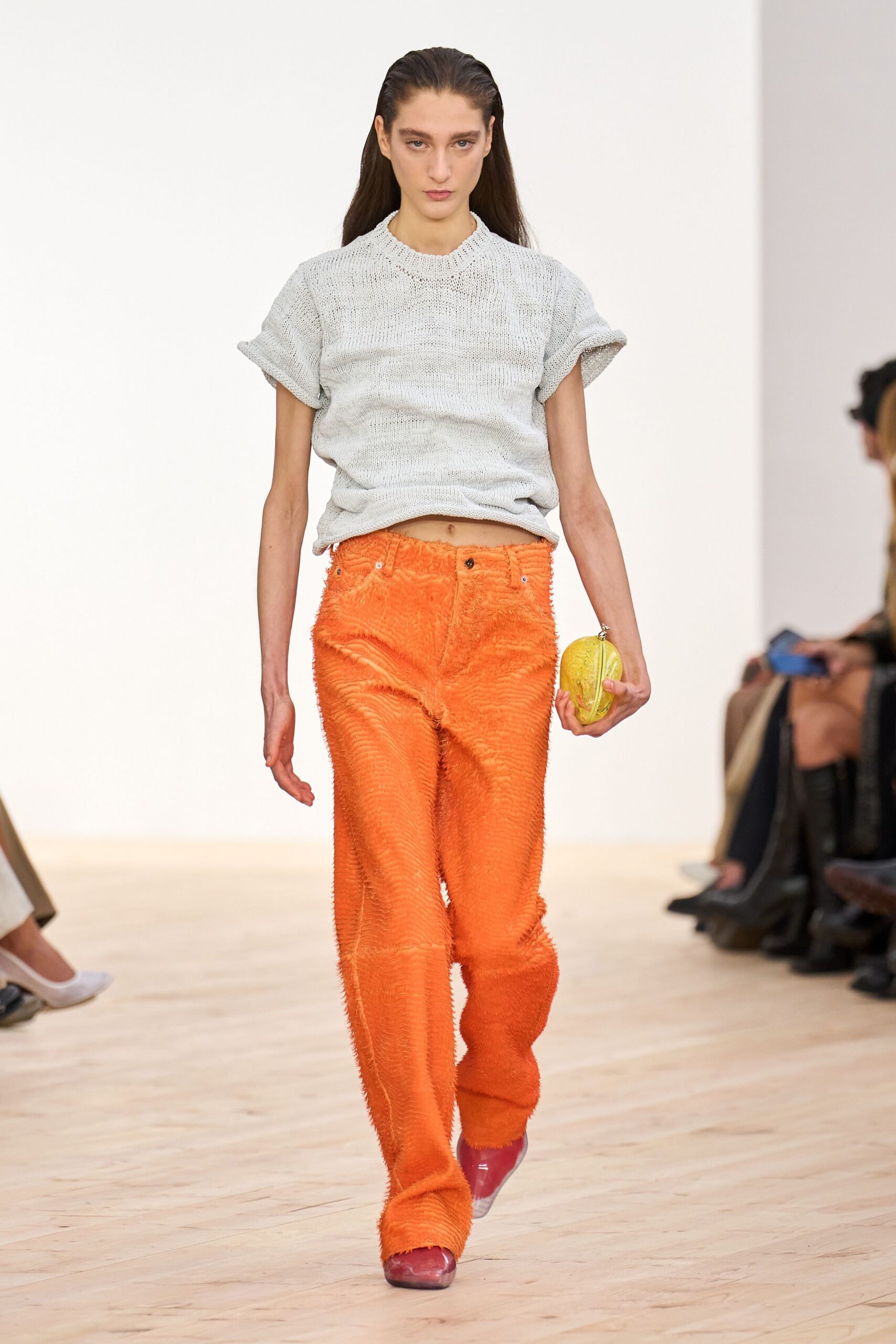gray relaxed top with orange pants