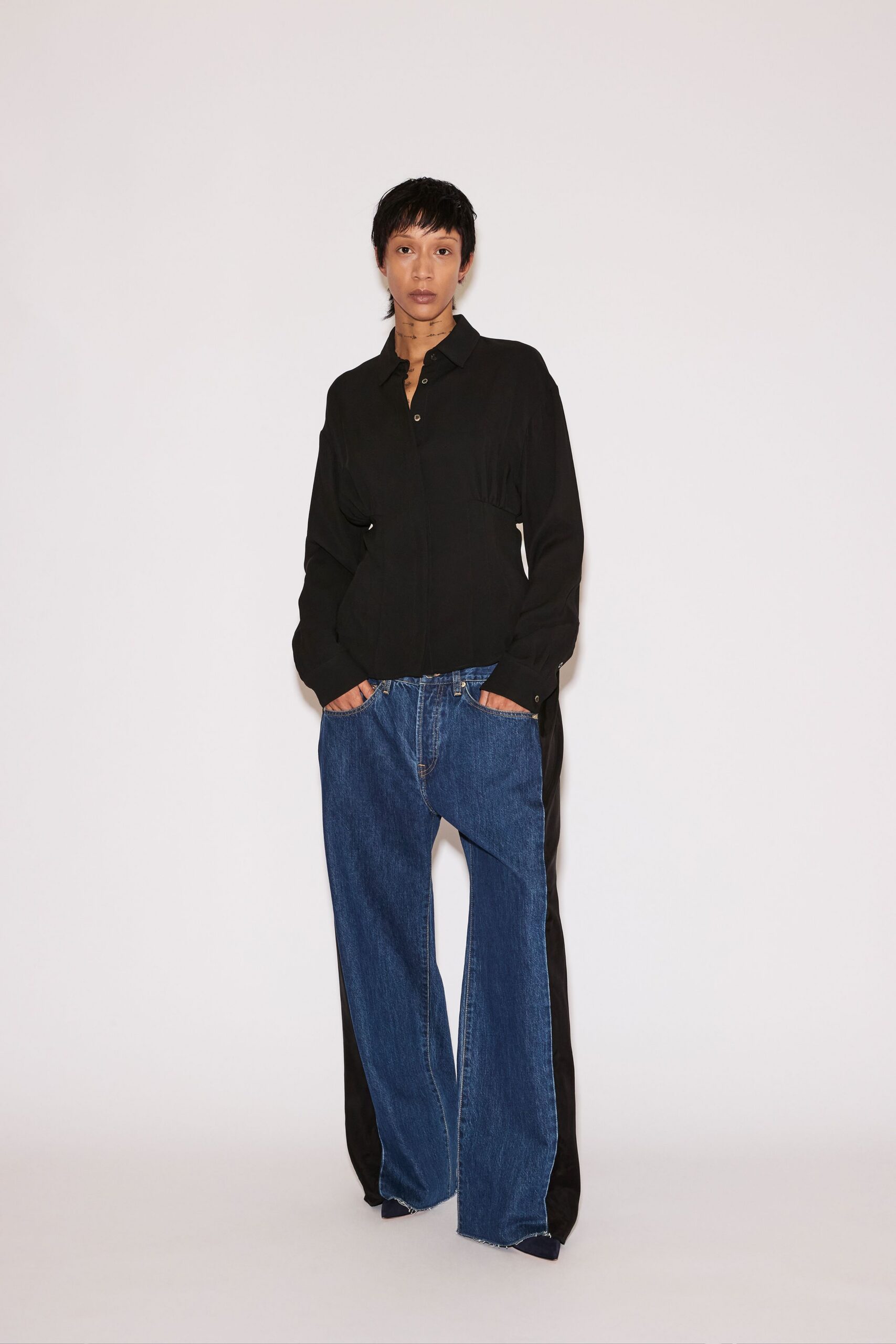 black relaxed shirt with blue pants