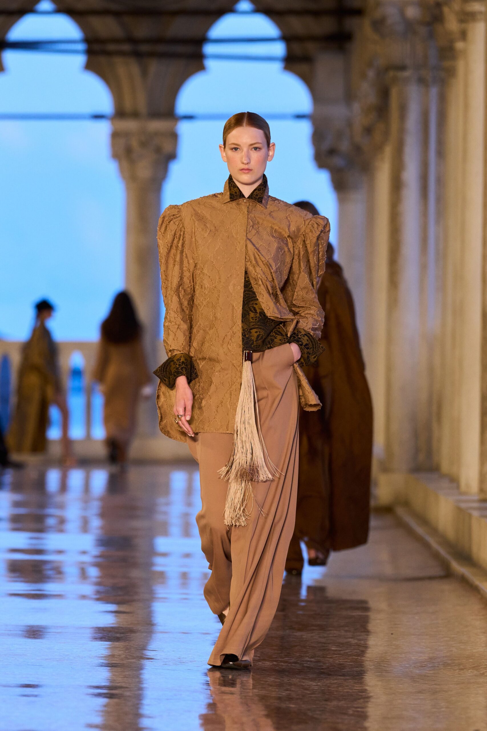 brown embroidered jacket with beige pants