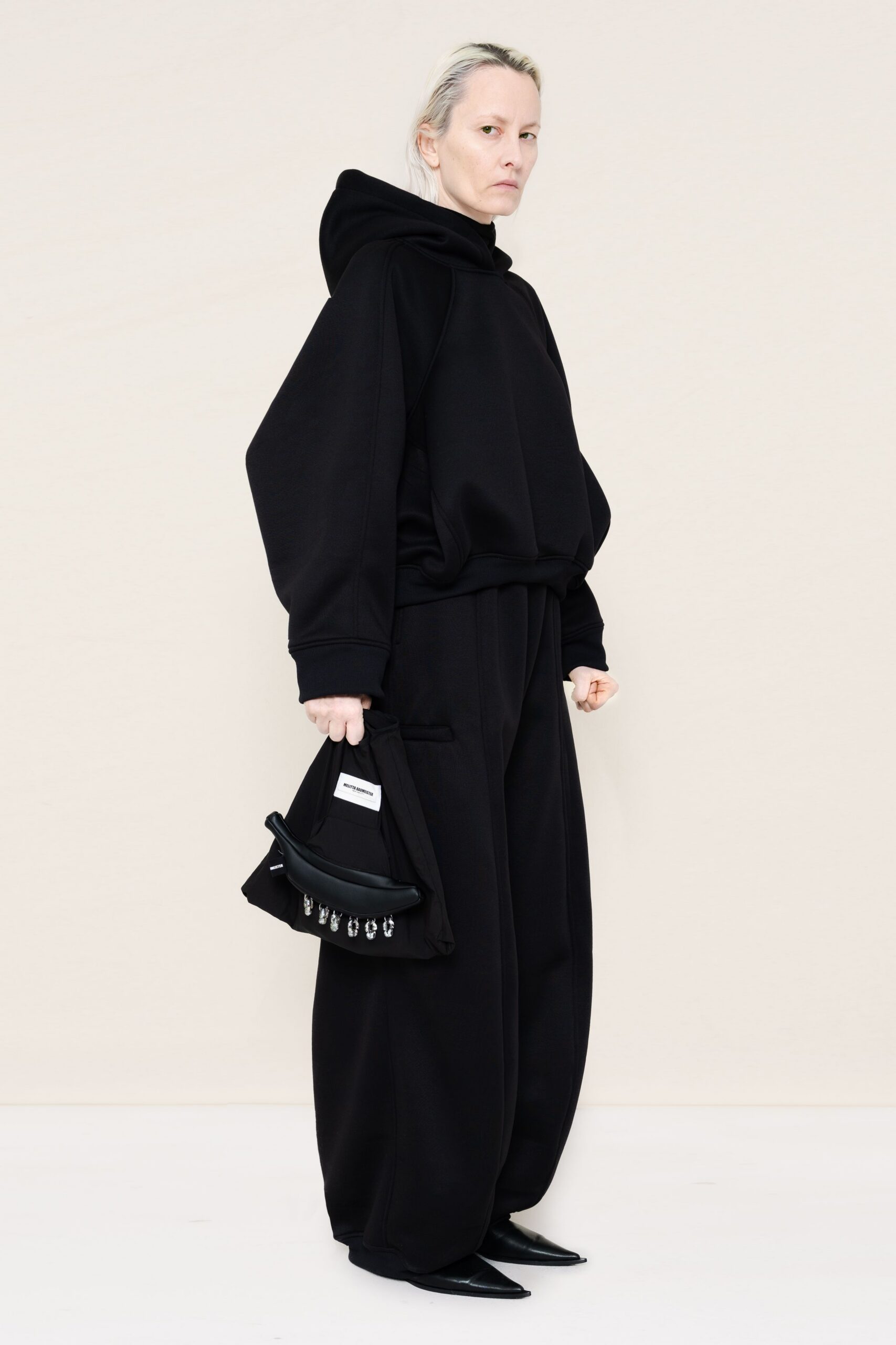 black oversized hoodie and relaxed pants