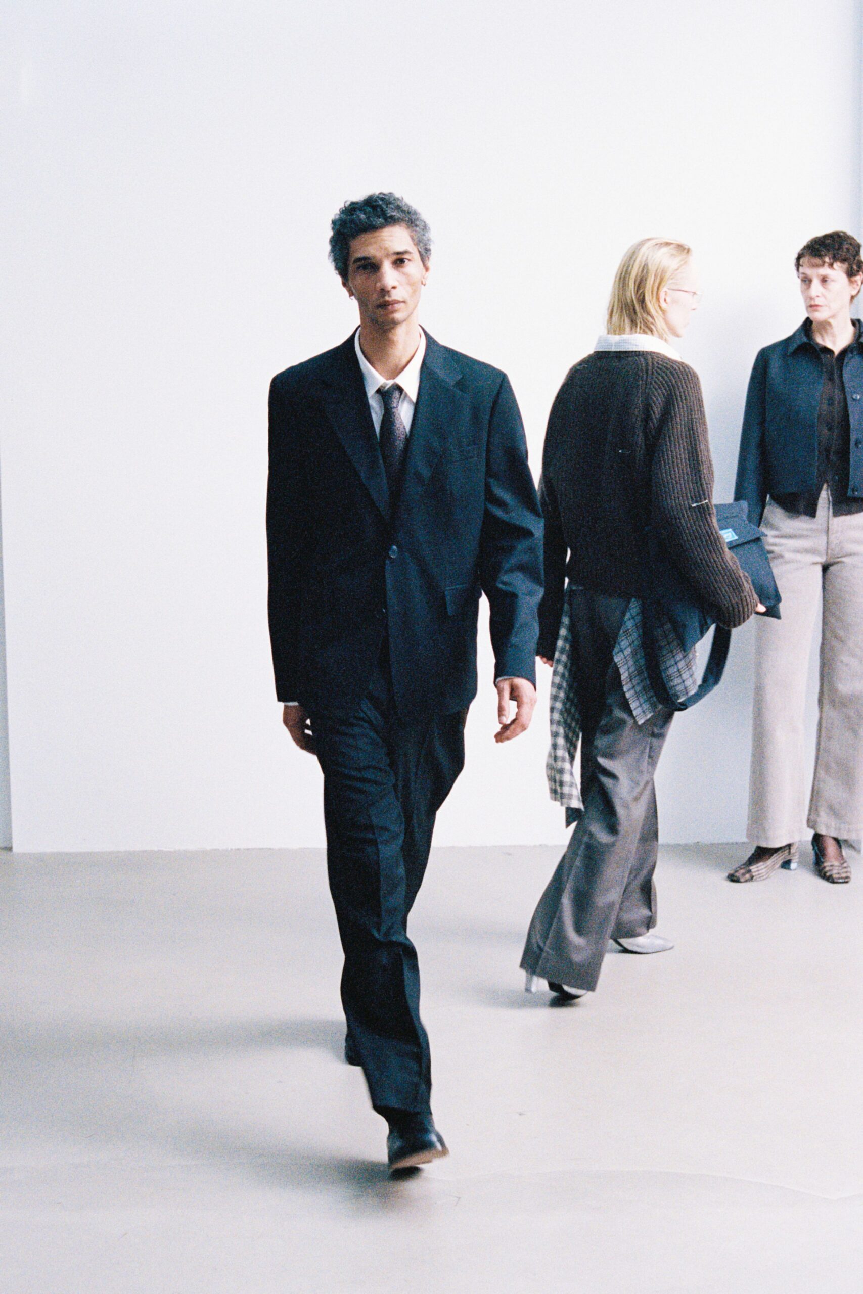 black tailored suit with white shirt