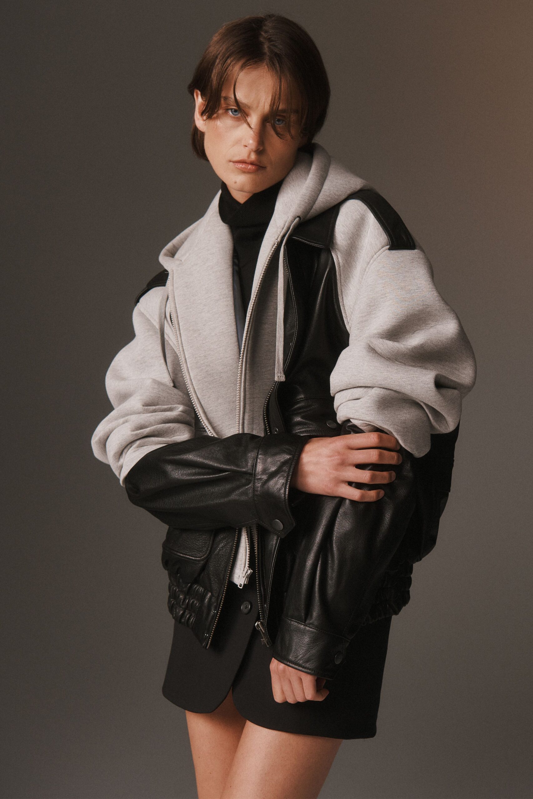 black leather long-sleeve collared oversized zippered pockets jacket