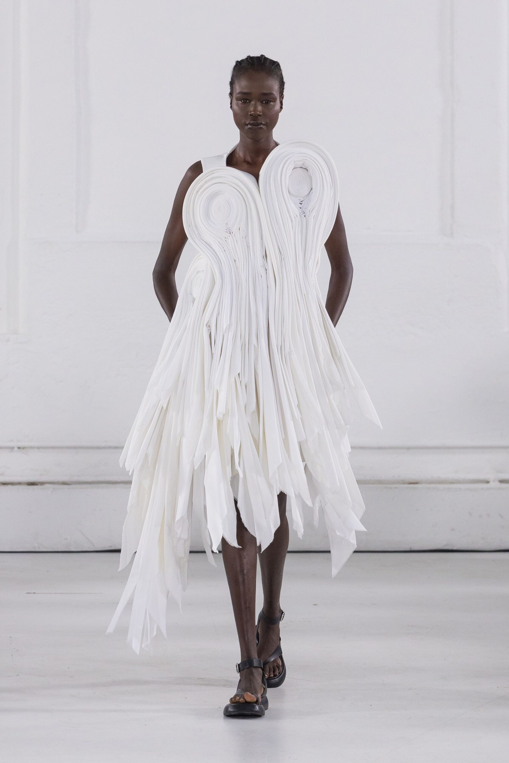 white pleated midi dress with black shoes